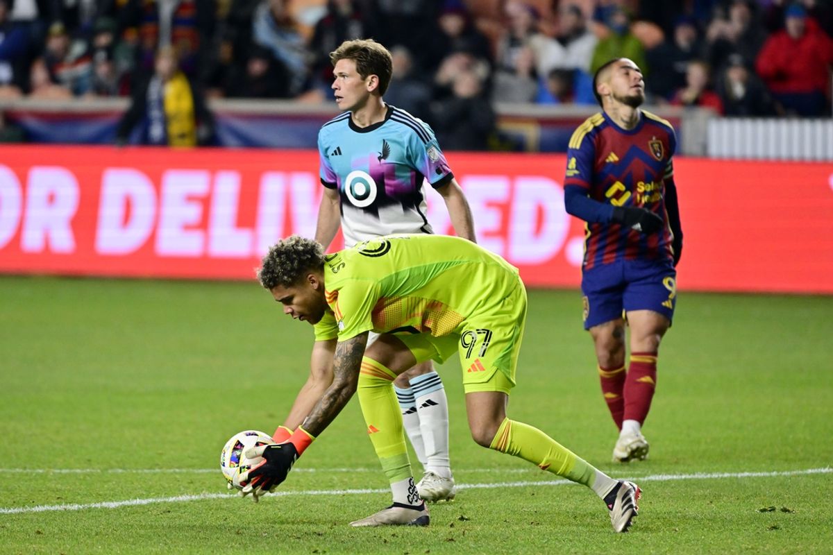 Oct 29, 2024; Sandy, Utah, USA; Minnesota United goalkeeper Dayne St. Clair (97) makes a save against Real Salt Lake forward Cristian Arango (9) in the second half in a 2024 MLS Cup Playoffs Round One match at America First Field. Mandatory Credit: Christopher Creveling-Imagn Images