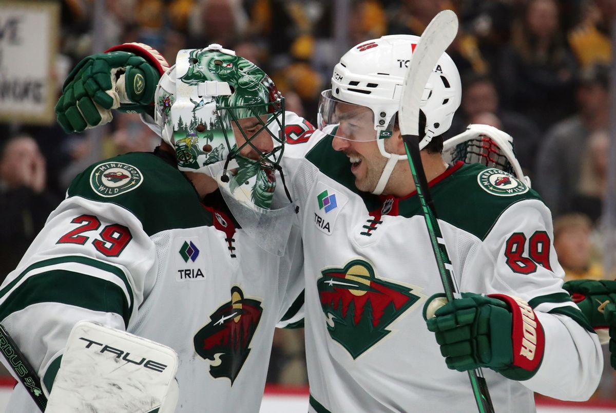 Oct 29, 2024; Pittsburgh, Pennsylvania, USA;  Minnesota Wild goaltender Marc-Andre Fleury (29) and center Frederick Gaudreau (89) celebrate after defeating the Pittsburgh Penguins at PPG Paints Arena. Mandatory Credit: Charles LeClaire-Imagn Images