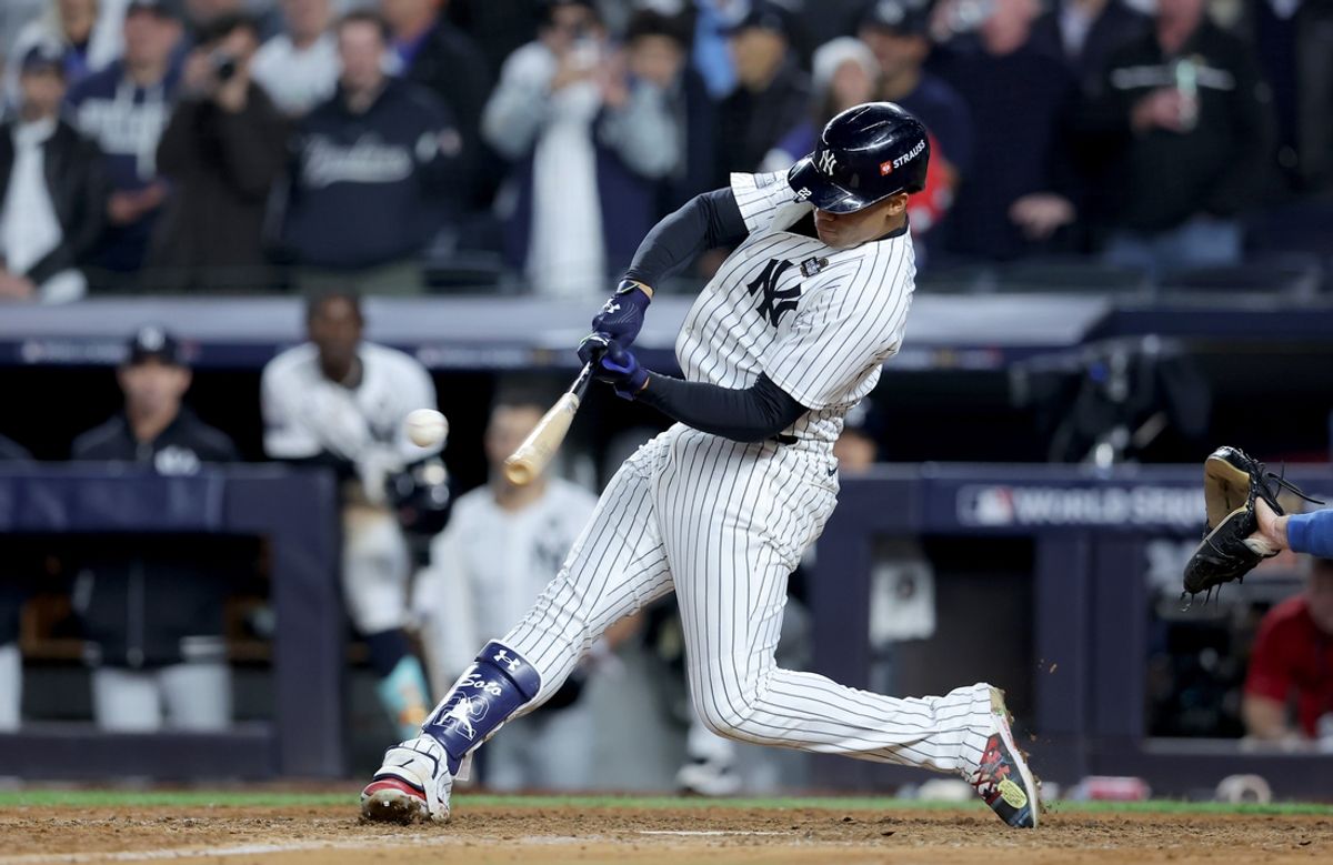 Oct 29, 2024; New York, New York, USA; New York Yankees outfielder Juan Soto (22) doubles during the eighth inning against the Los Angeles Dodgers in game four of the 2024 MLB World Series at Yankee Stadium. Mandatory Credit: Brad Penner-Imagn Images
