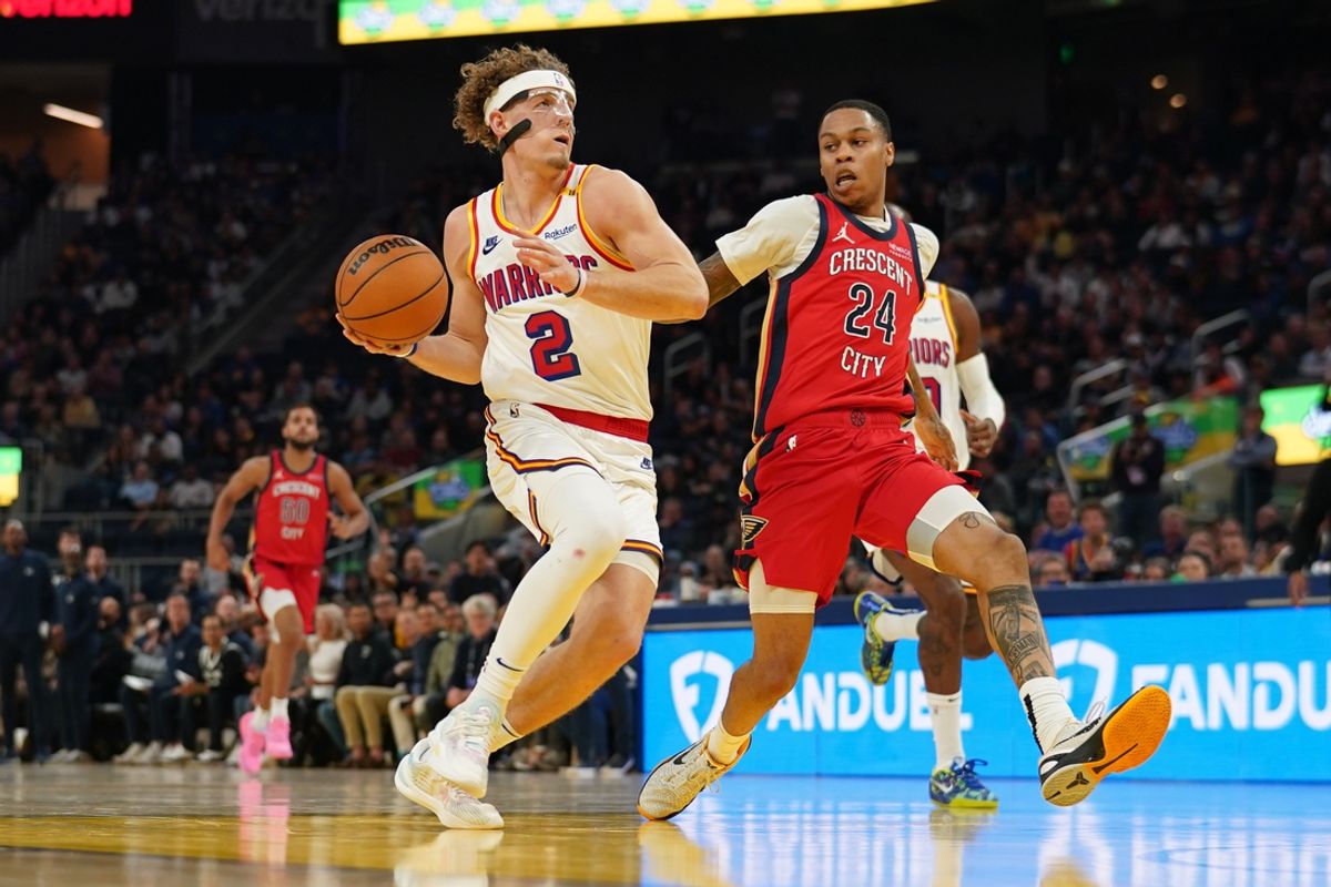 Oct 29, 2024; San Francisco, California, USA; Golden State Warriors guard Brandin Podziemski (2) drives past New Orleans Pelicans guard Jordan Hawkins (24) in the second quarter at the Chase Center. Mandatory Credit: Cary Edmondson-Imagn Images