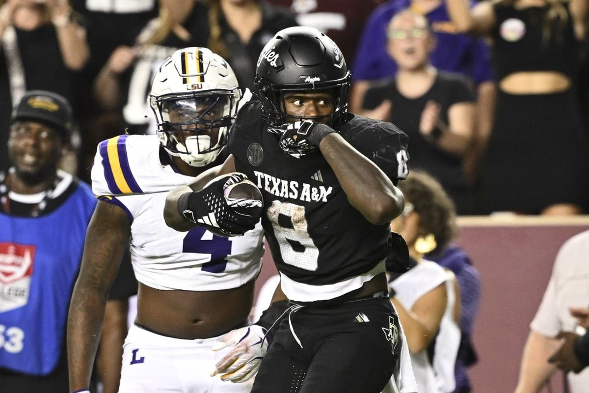 Oct 26, 2024; College Station, Texas, USA; Texas A&M Aggies running back Le'Veon Moss (8) reacts against the LSU Tigers during the third quarter. The Aggies defeated the Tigers 38-23; at Kyle Field. Mandatory Credit: Maria Lysaker-Imagn Images.