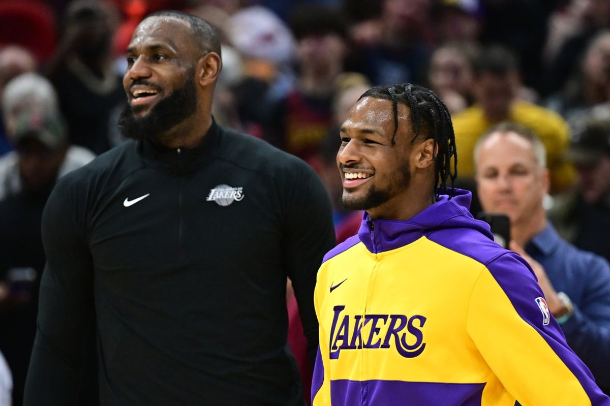 Oct 30, 2024; Cleveland, Ohio, USA; Los Angeles Lakers guard Bronny James, right, and forward LeBron James warm up before the game between the Cleveland Cavaliers and the Lakers at Rocket Mortgage FieldHouse. Mandatory Credit: Ken Blaze-Imagn Images