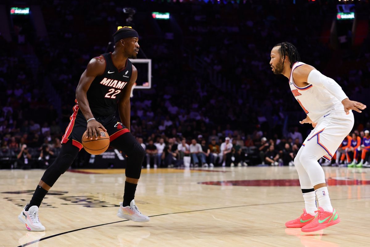 Oct 30, 2024; Miami, Florida, USA; Miami Heat forward Jimmy Butler (22) dribbles the basketball as New York Knicks guard Jalen Brunson (11) defends during the first quarter at Kaseya Center. Mandatory Credit: Sam Navarro-Imagn Images
