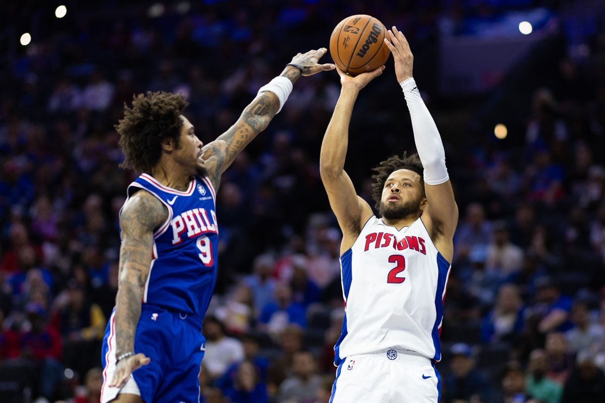 Oct 30, 2024; Philadelphia, Pennsylvania, USA; Detroit Pistons guard Cade Cunningham (2) shoots past Philadelphia 76ers guard Kelly Oubre Jr. (9) during the second quarter at Wells Fargo Center. Mandatory Credit: Bill Streicher-Imagn Images
