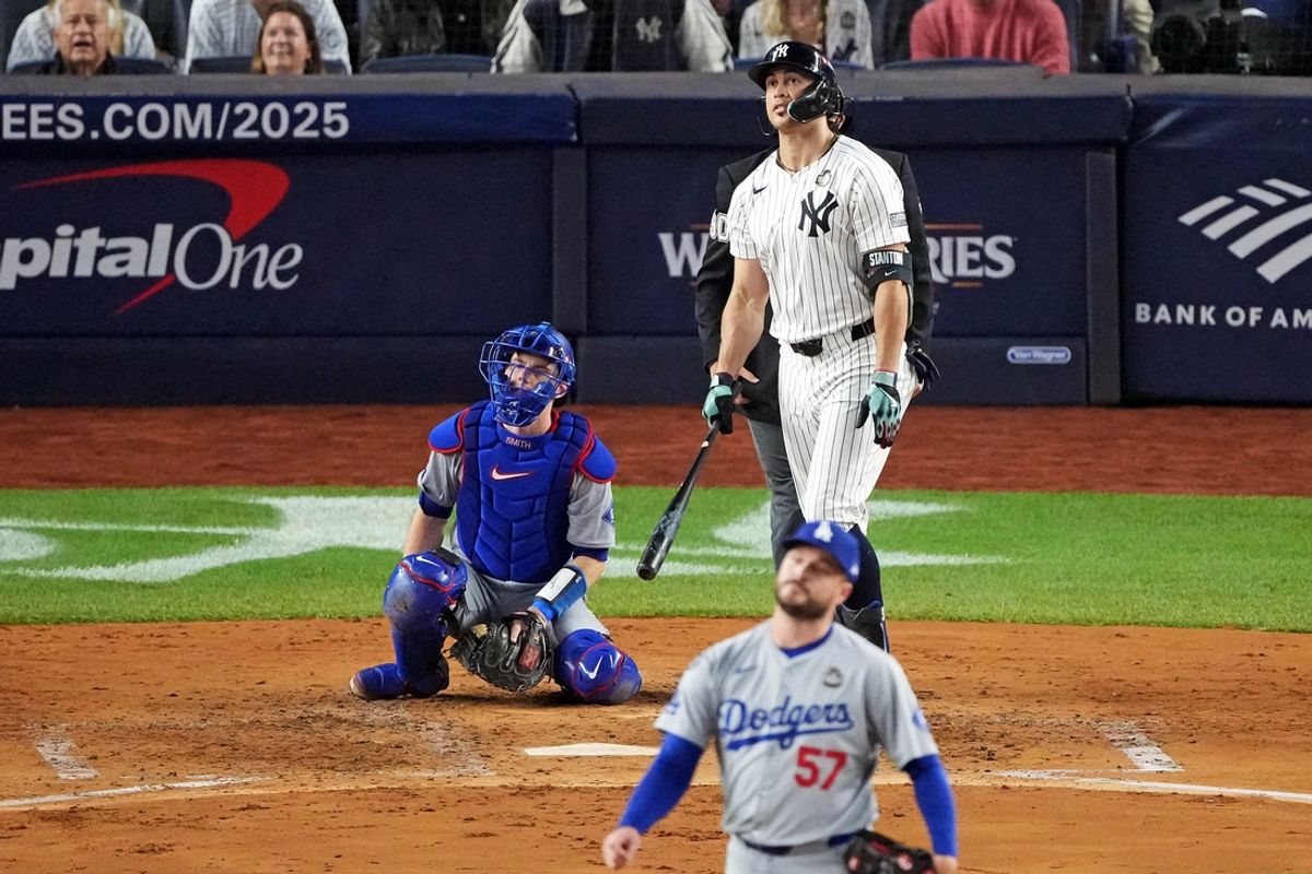 Oct 30, 2024; New York, New York, USA; New York Yankees designated hitter Giancarlo Stanton (27) hits a solo home run off of Los Angeles Dodgers pitcher Ryan Brasier (57) during the third inning in game four of the 2024 MLB World Series at Yankee Stadium. Mandatory Credit: Robert Deutsch-Imagn Images