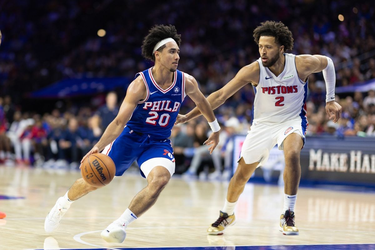 Oct 30, 2024; Philadelphia, Pennsylvania, USA; Philadelphia 76ers guard Jared McCain (20) drives against Detroit Pistons guard Cade Cunningham (2) during the fourth quarter at Wells Fargo Center. Mandatory Credit: Bill Streicher-Imagn Images