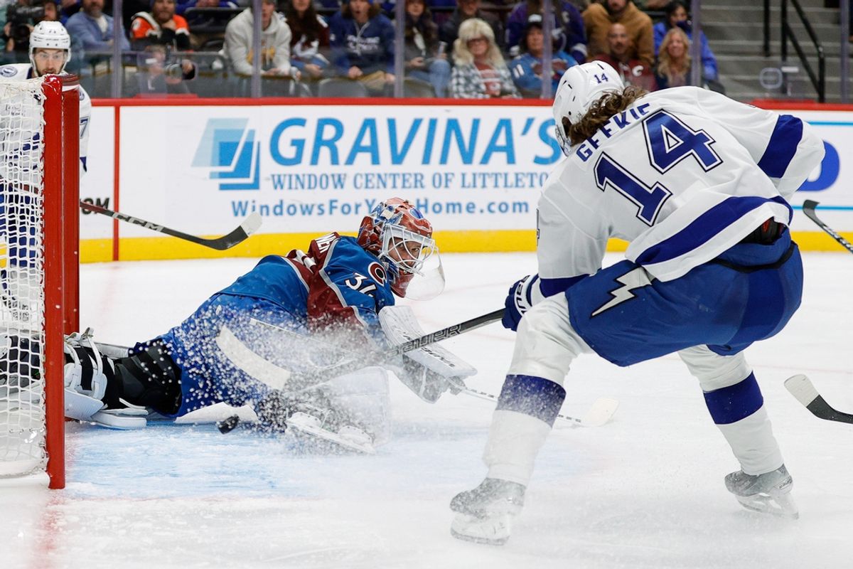 Oct 30, 2024; Denver, Colorado, USA; Tampa Bay Lightning center Conor Geekie (14) scores a goal against Colorado Avalanche goaltender Kaapo Kahkonen (34) in the first period at Ball Arena. Mandatory Credit: Isaiah J. Downing-Imagn Images