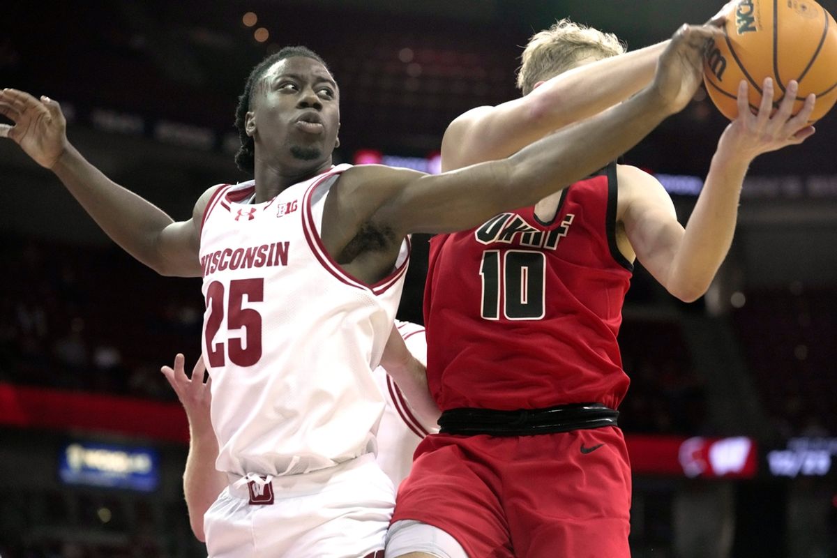Wisconsin guard John Blackwell (25) tries to swat the all away from UW-River Falls guard Gavin Ralph (10) during the first half of their preseason game Wednesday, October 30, 2024 at the Kohl Center in Madison, Wisconsin.