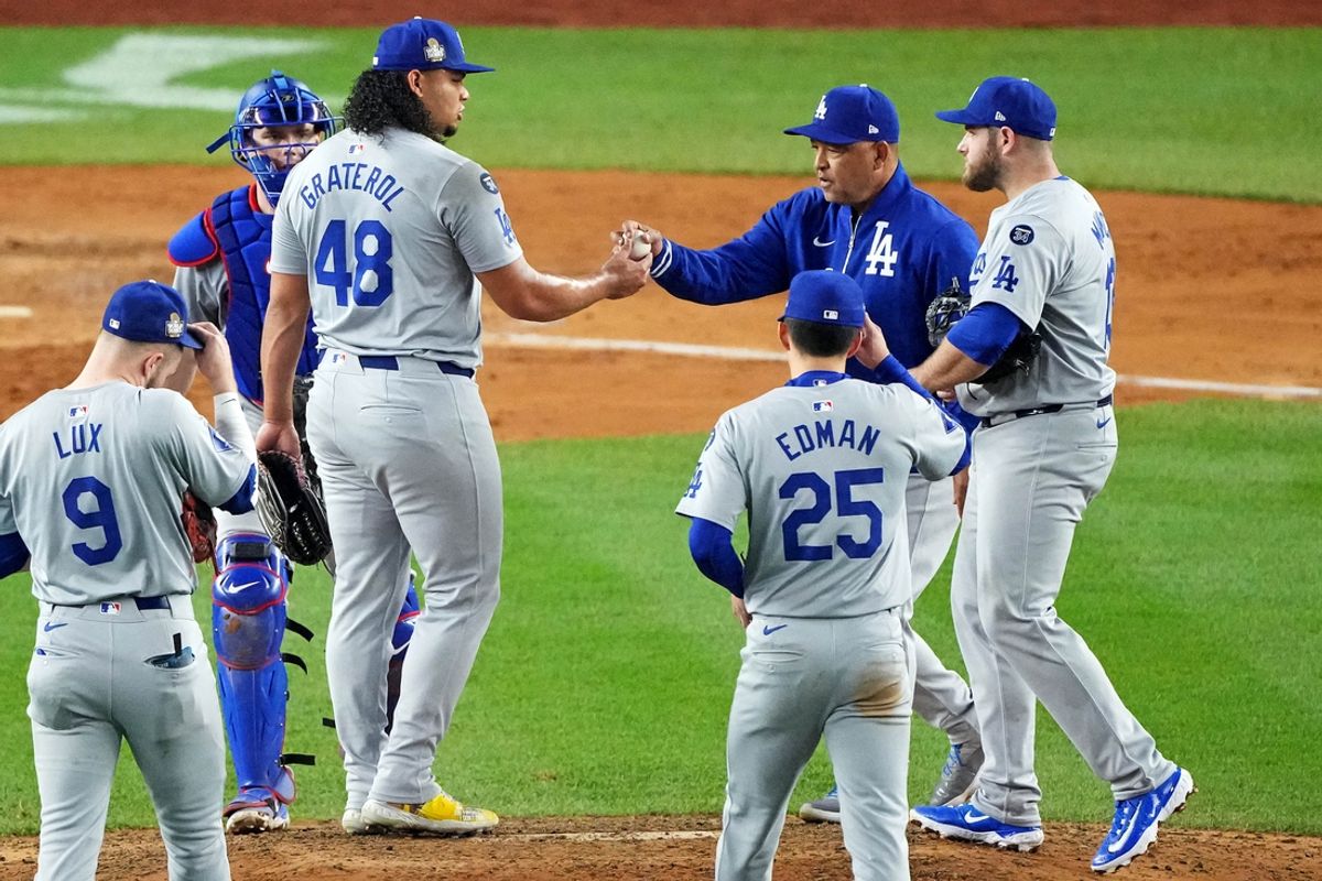 Oct 30, 2024; New York, New York, USA; Los Angeles Dodgers manager Dave Roberts (30) relieves pitcher Brusdar Graterol (48) during the sixth inning against the New York Yankees in game four of the 2024 MLB World Series at Yankee Stadium. Mandatory Credit: Robert Deutsch-Imagn Images