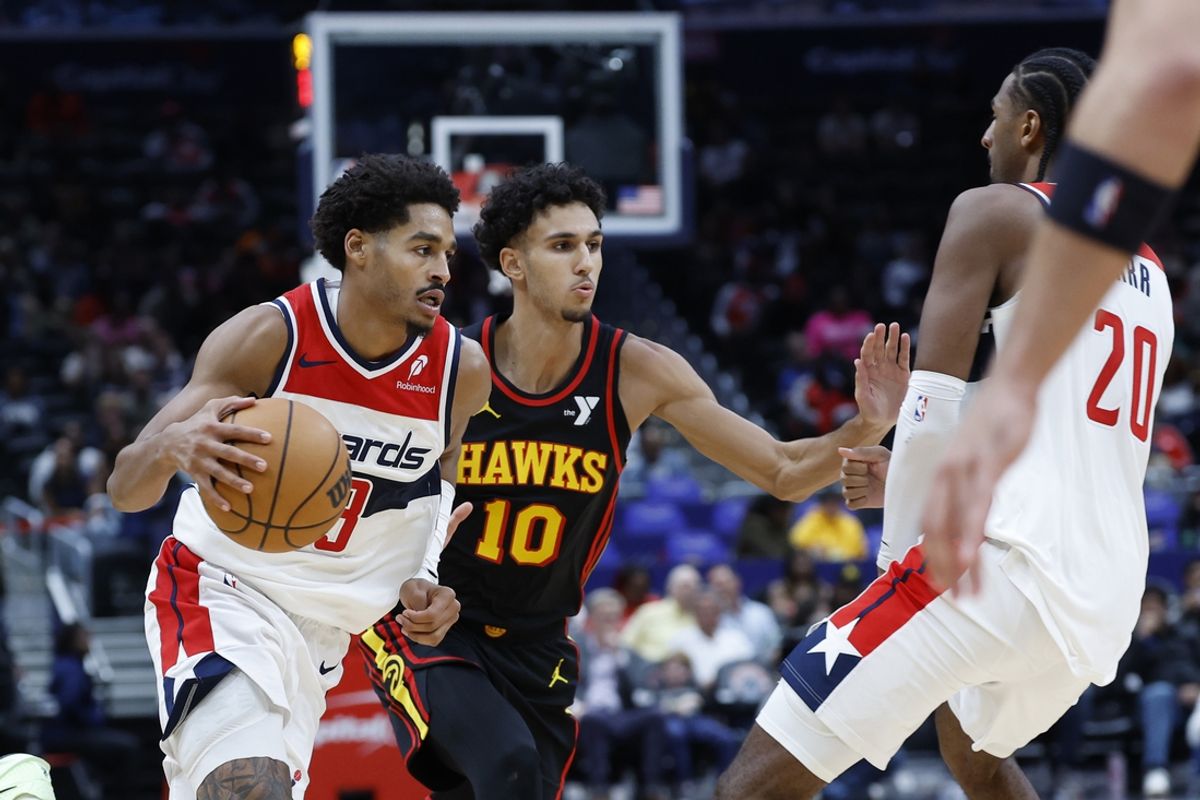 Oct 30, 2024; Washington, District of Columbia, USA; Washington Wizards guard Jordan Poole (13) drives to the basket as Atlanta Hawks forward Zaccharie Risacher (10) defends in the second half at Capital One Arena. Mandatory Credit: Geoff Burke-Imagn Images