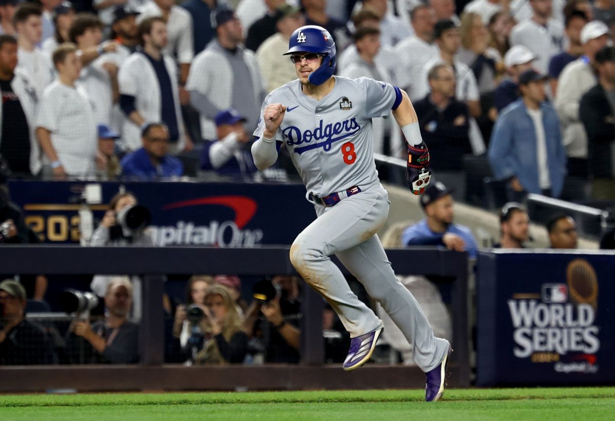 Oct 30, 2024; New York, New York, USA; Los Angeles Dodgers third baseman Enrique Hernandez (8) scores during the eighth inning against the New York Yankees in game five of the 2024 MLB World Series at Yankee Stadium. Mandatory Credit: Vincent Carchietta-Imagn Images
