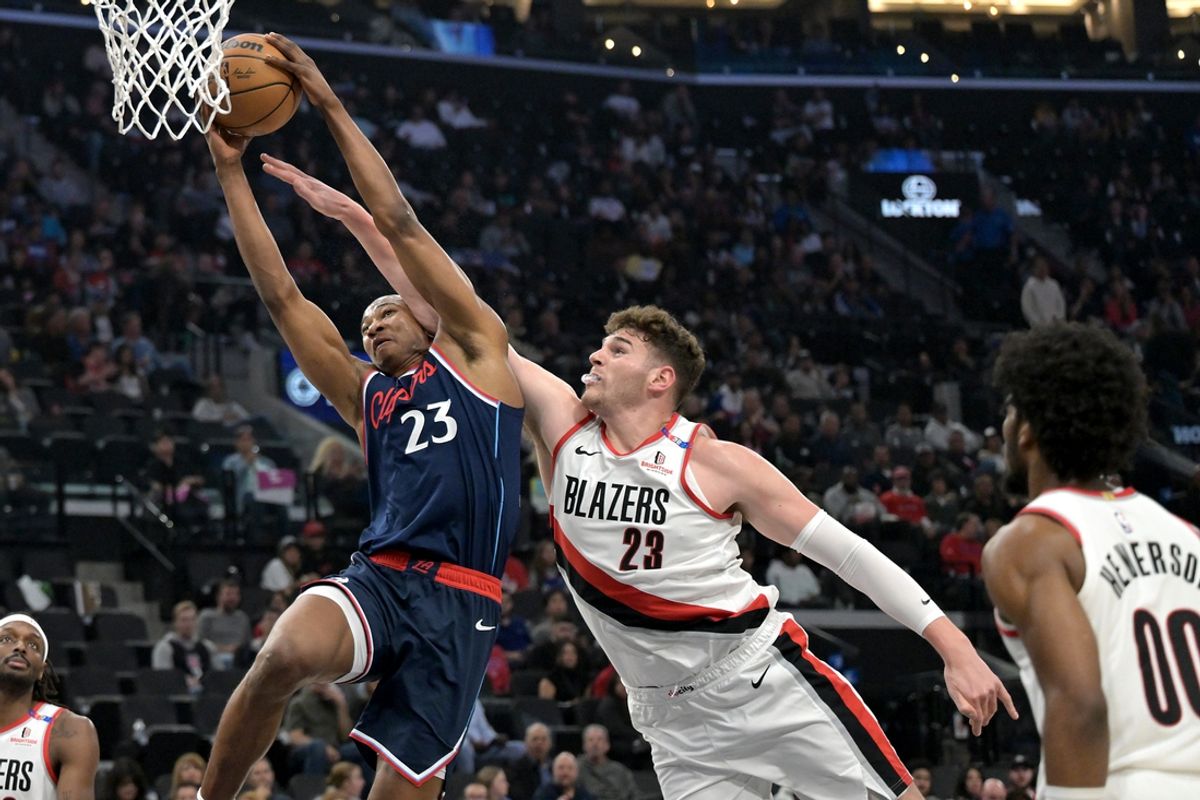 Oct 30, 2024; Inglewood, California, USA;  Los Angeles Clippers forward Kai Jones (23) gets past Portland Trail Blazers center Donovan Clingan (23) for a dunk in the first half at Intuit Dome. Mandatory Credit: Jayne Kamin-Oncea-Imagn Images