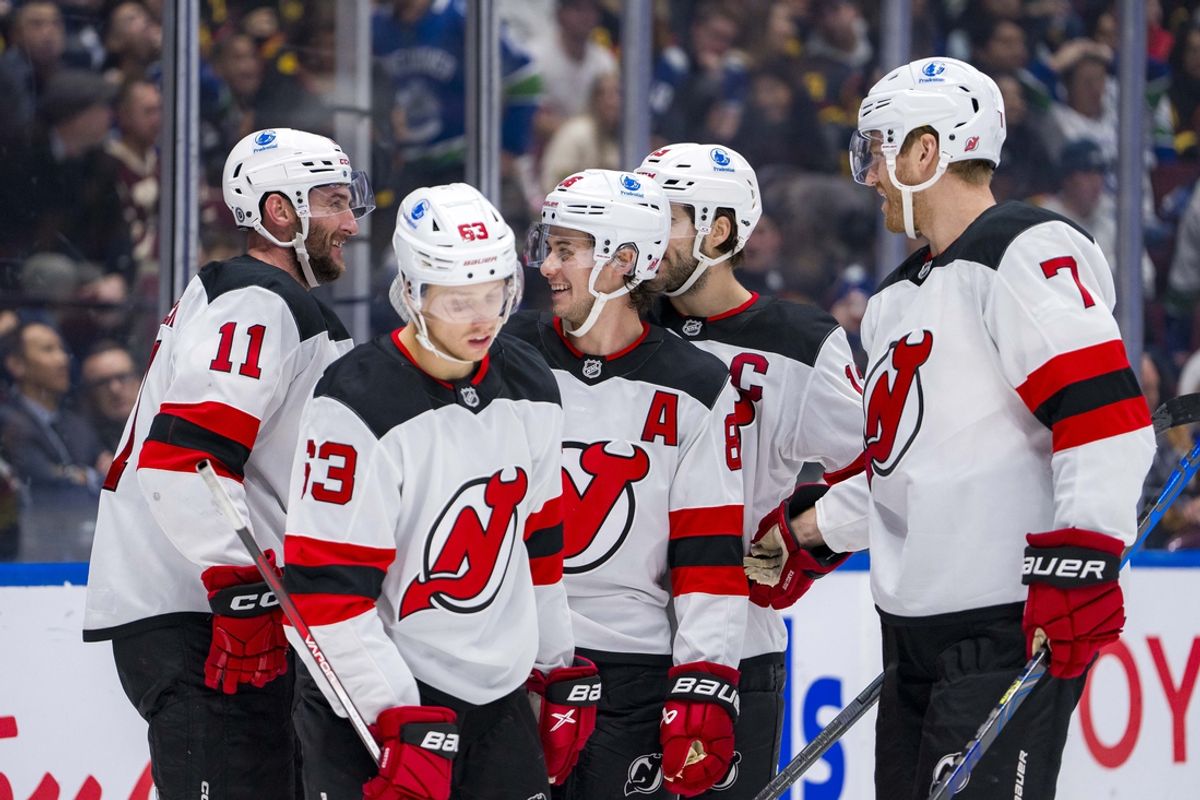 Oct 30, 2024; Vancouver, British Columbia, CAN; New Jersey Devils forward Jesper Bratt (63) and forward Stefan Noesen (11) and forward Jack Hughes (86) and forward Nico Hischier (13) celebrate Jack Hughes’ goal against the Vancouver Canucks during the third period at Rogers Arena. Mandatory Credit: Bob Frid-Imagn Images