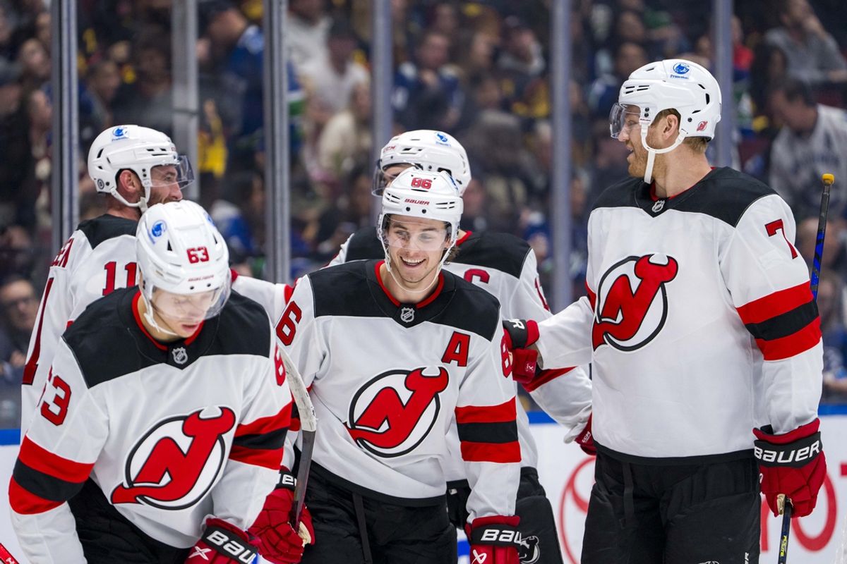 Oct 30, 2024; Vancouver, British Columbia, CAN; New Jersey Devils forward Jesper Bratt (63) and forward Stefan Noesen (11) and forward Jack Hughes (86) and forward Nico Hischier (13) celebrate Jack Hughes’ goal against the Vancouver Canucks during the third period at Rogers Arena. Mandatory Credit: Bob Frid-Imagn Images