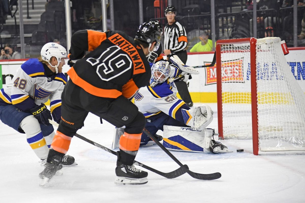 Oct 31, 2024; Philadelphia, Pennsylvania, USA; Philadelphia Flyers right wing Garnet Hathaway (19) scores a goal past St. Louis Blues goaltender Jordan Binnington (50) during the first period at Wells Fargo Center. Mandatory Credit: Eric Hartline-Imagn Images