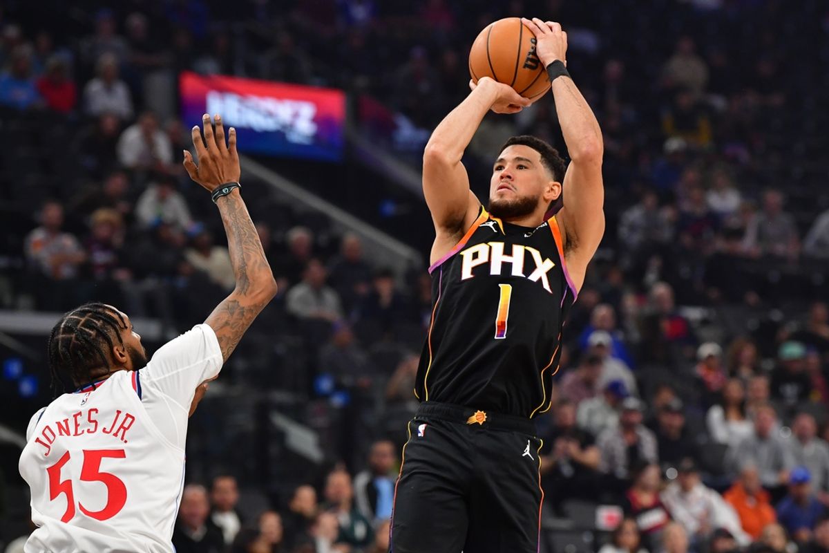 Oct 31, 2024; Inglewood, California, USA; Phoenix Suns guard Devin Booker (1) shoots against Los Angeles Clippers forward Derrick Jones Jr. (55) during the first half at Intuit Dome. Mandatory Credit: Gary A. Vasquez-Imagn Images