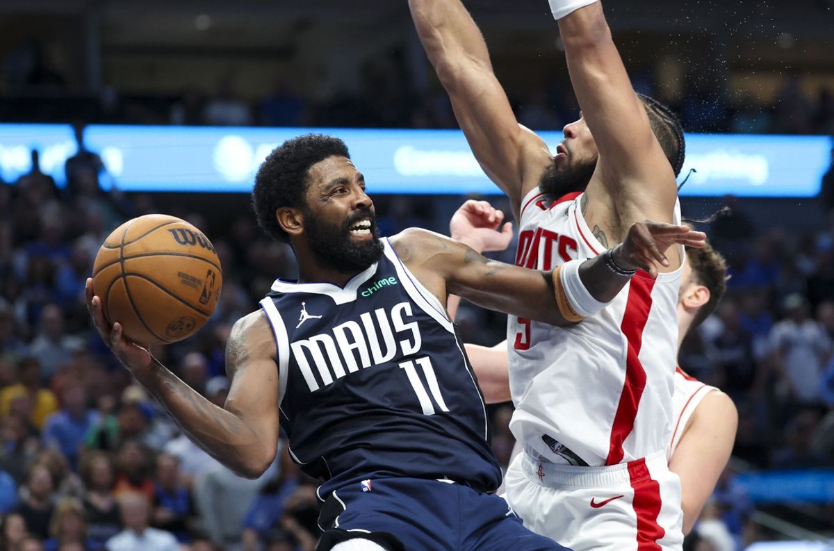 Oct 31, 2024; Dallas, Texas, USA;  Dallas Mavericks guard Kyrie Irving (11) looks to pass as Houston Rockets forward Dillon Brooks (9) defends during the second half at American Airlines Center. Mandatory Credit: Kevin Jairaj-Imagn Images