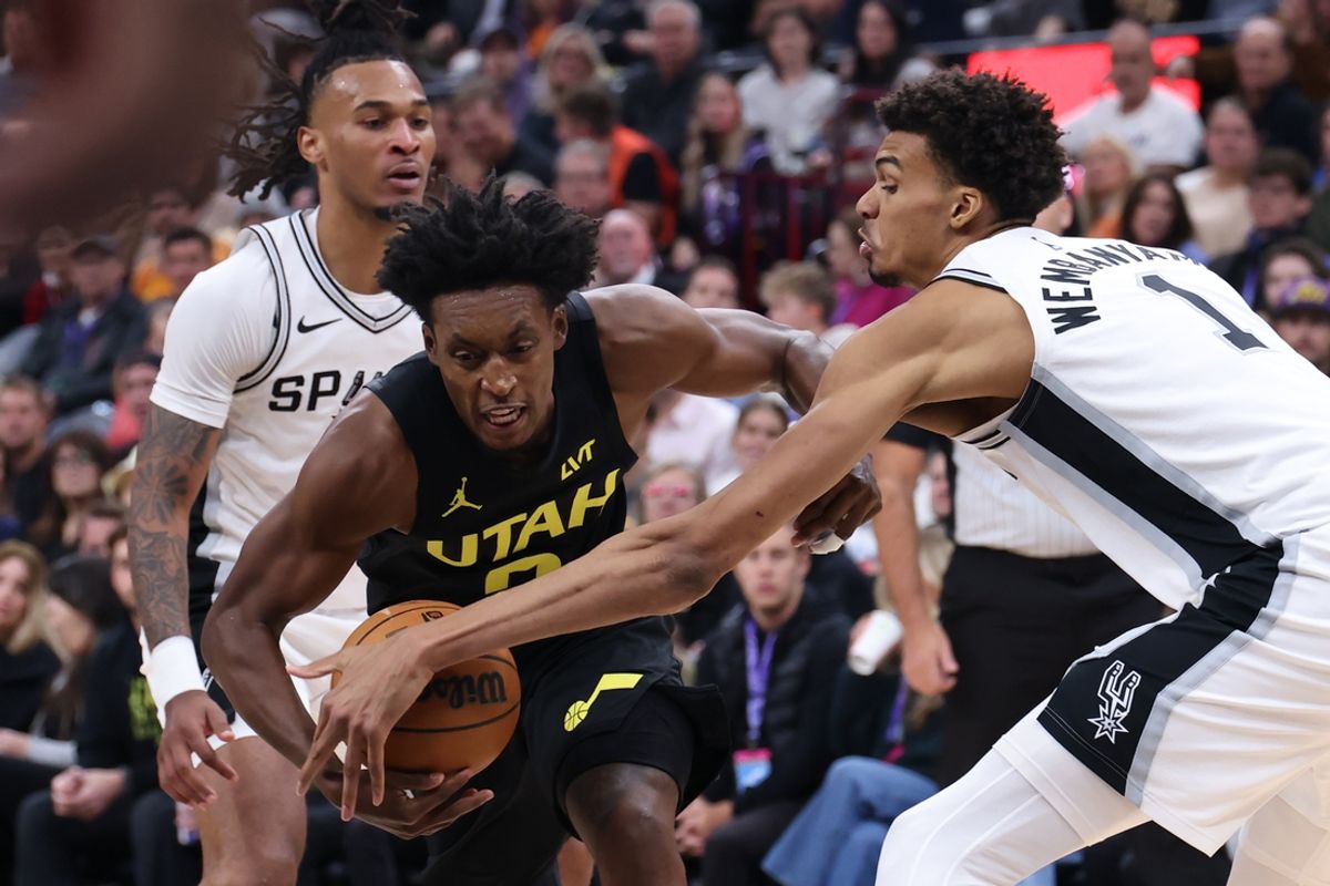 Oct 31, 2024; Salt Lake City, Utah, USA; San Antonio Spurs center Victor Wembanyama (1) reaches for the ball against Utah Jazz guard Collin Sexton (2) during the fourth quarter at Delta Center. Mandatory Credit: Rob Gray-Imagn Images