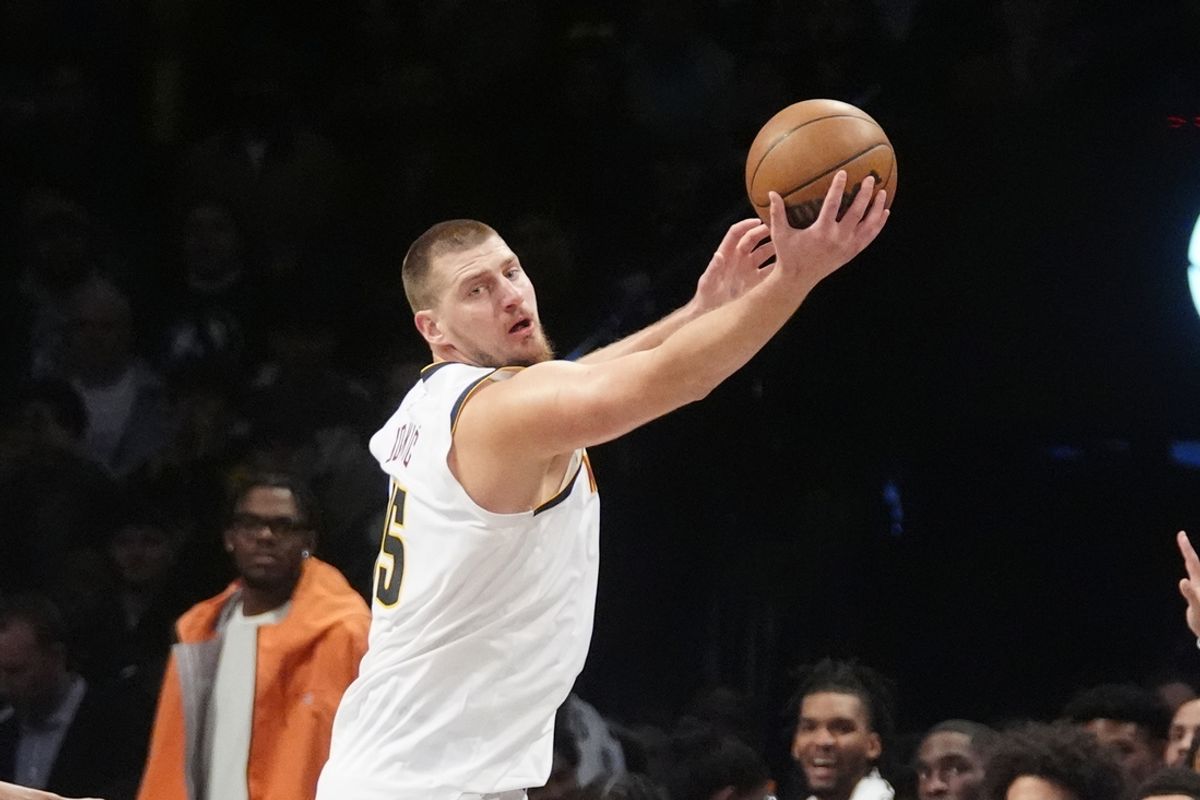 Oct 29, 2024; Brooklyn, New York, USA; Denver Nuggets center Nikola Jokic (15) receives a pass against the Brooklyn Nets during the second half at Barclays Center. Mandatory Credit: Gregory Fisher-Imagn Images
