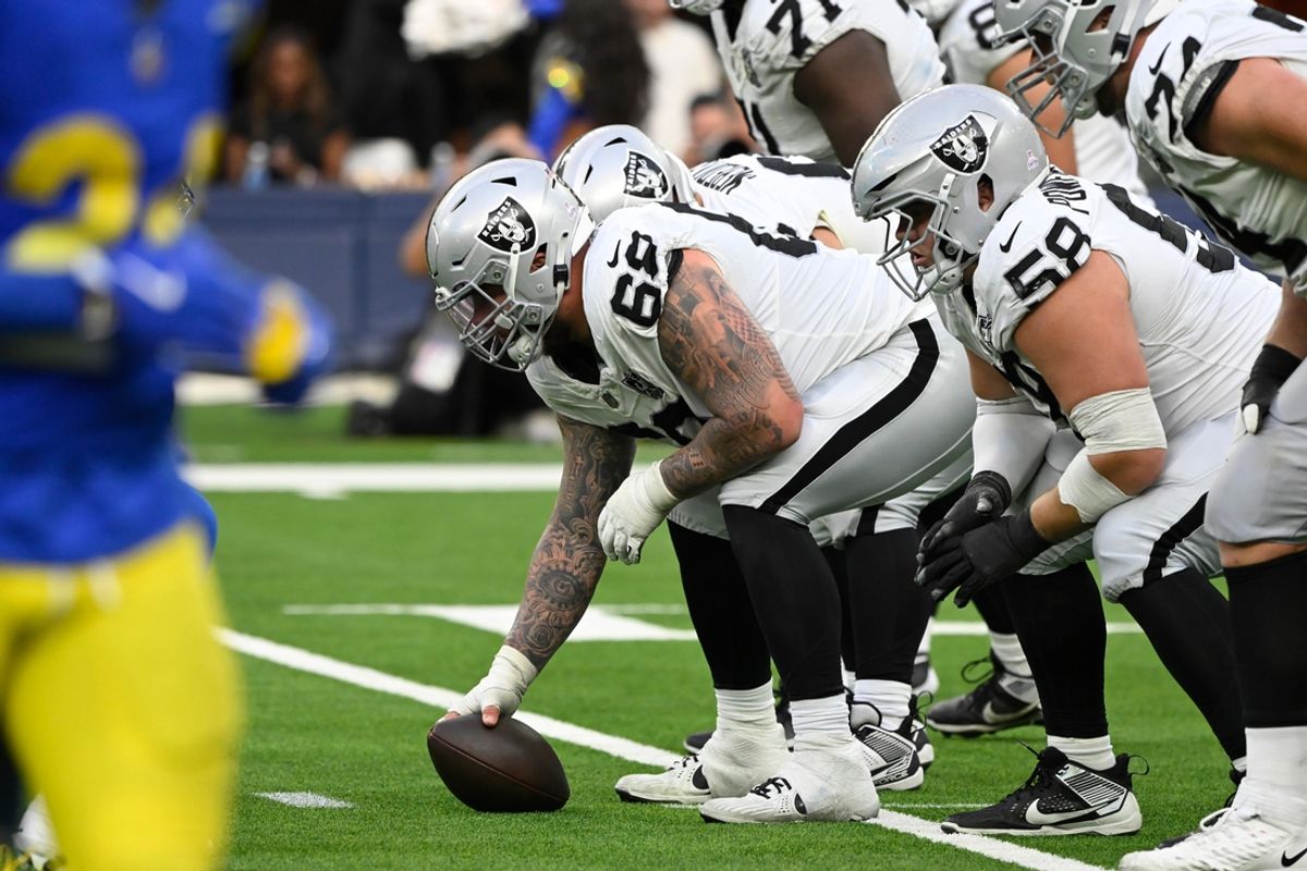 Oct 20, 2024; Inglewood, California, USA; Las Vegas Raiders center Andre James (68) and Las Vegas Raiders guard Jackson Powers-Johnson (58) driving the fourth quarter against the Los Angeles Rams at SoFi Stadium. Mandatory Credit: Robert Hanashiro-Imagn Images