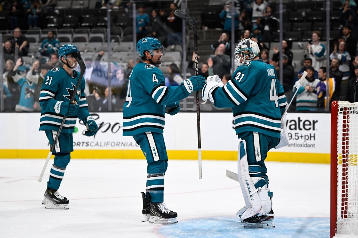 Oct 29, 2024; San Jose, California, USA; San Jose Sharks defenseman Cody Ceci (4) celebrates with center Alexander Wennberg (21) and San Jose Sharks goaltender Vitek Vanecek (41) after their win over the Los Angeles Kings at SAP Center at San Jose. Mandatory Credit: Eakin Howard-Imagn Images