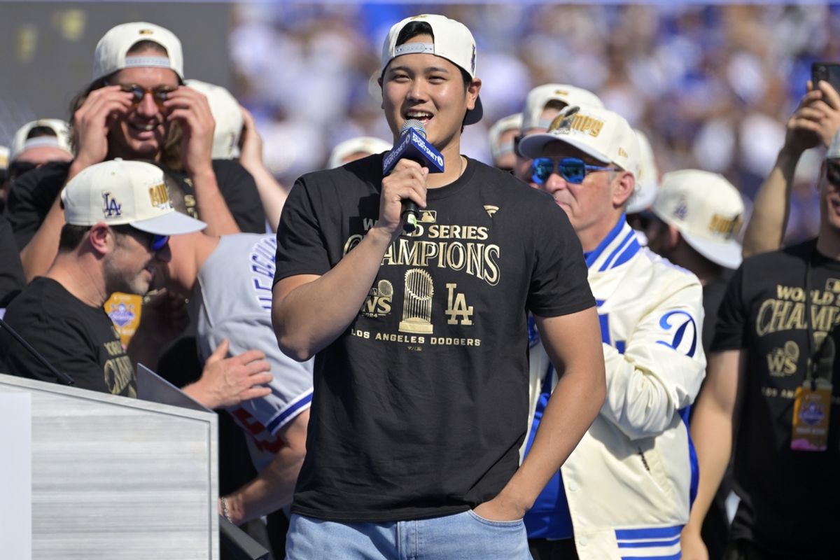 Nov 1, 2024; Los Angeles, CA, USA;  Los Angeles Dodgers designated hitter Shohei Ohtani (17) to speak to fans, in english, during the World Series Championship Celebration at Dodger Stadium. Mandatory Credit: Jayne Kamin-Oncea-Imagn Images