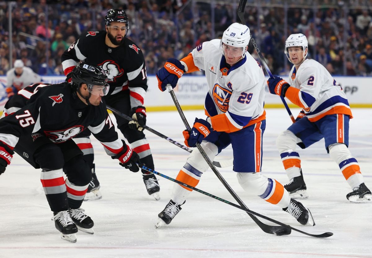 Nov 1, 2024; Buffalo, New York, USA;  Buffalo Sabres defenseman Connor Clifton (75) tries to block a shot by New York Islanders center Brock Nelson (29) during the first period at KeyBank Center. Mandatory Credit: Timothy T. Ludwig-Imagn Images