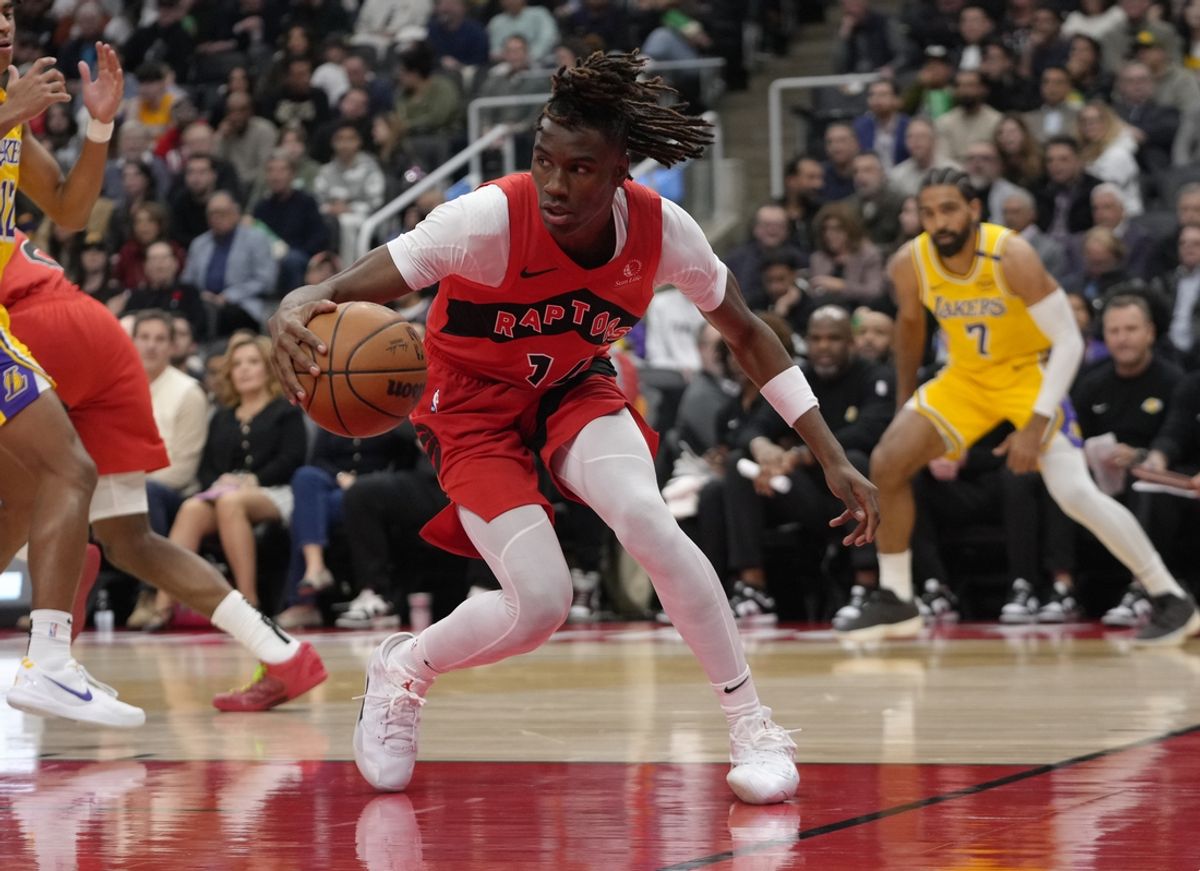 Nov 1, 2024; Toronto, Ontario, CAN; Toronto Raptors guard Ja'Kobe Walter (14) tries to control the ball against the Los Angeles Lakers during the first half at Scotiabank Arena. Mandatory Credit: John E. Sokolowski-Imagn Images