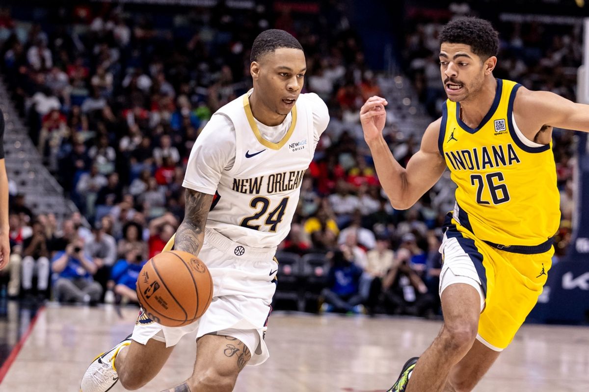 Nov 1, 2024; New Orleans, Louisiana, USA;  New Orleans Pelicans guard Jordan Hawkins (24) dribbles against Indiana Pacers guard Ben Sheppard (26) during the first half at Smoothie King Center. Mandatory Credit: Stephen Lew-Imagn Images