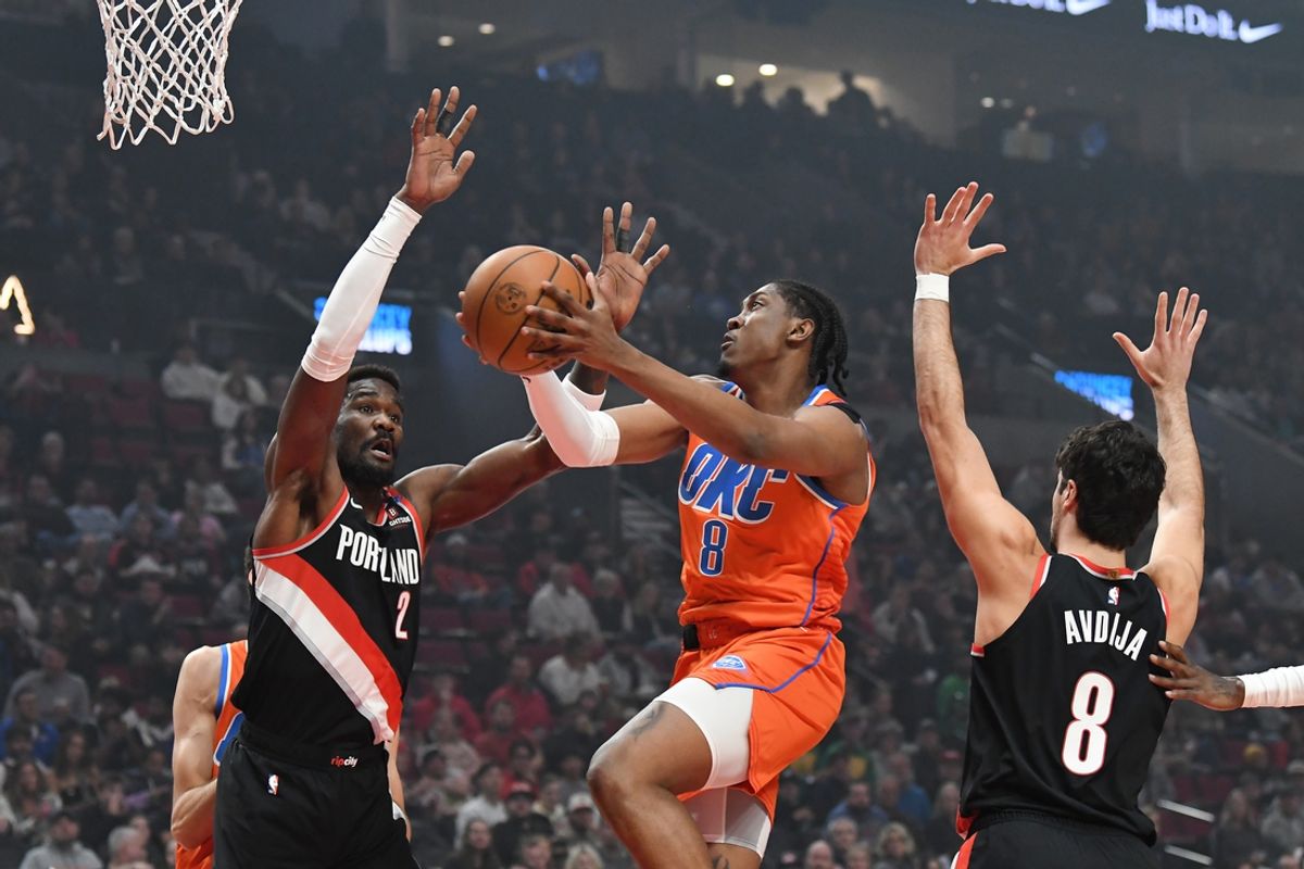 Nov 1, 2024; Portland, Oregon, USA; Oklahoma City Thunder guard/forward Jalen Williams (8) drives to the basket against Portland Trailblazers center Deandre Ayton (2) and forward Deni Avdija (8) during the first quarter at Moda Center. Mandatory Credit: Brian Murphy-Imagn Images