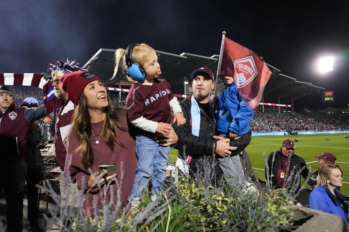 Nov 1, 2024; Commerce City, Colorado, USA; Colorado Rapids fans cheer before the game against the LA Galaxy in a 2024 MLS Cup Playoffs Round One match at Dick's Sporting Goods Park. Mandatory Credit: Ron Chenoy-Imagn Images