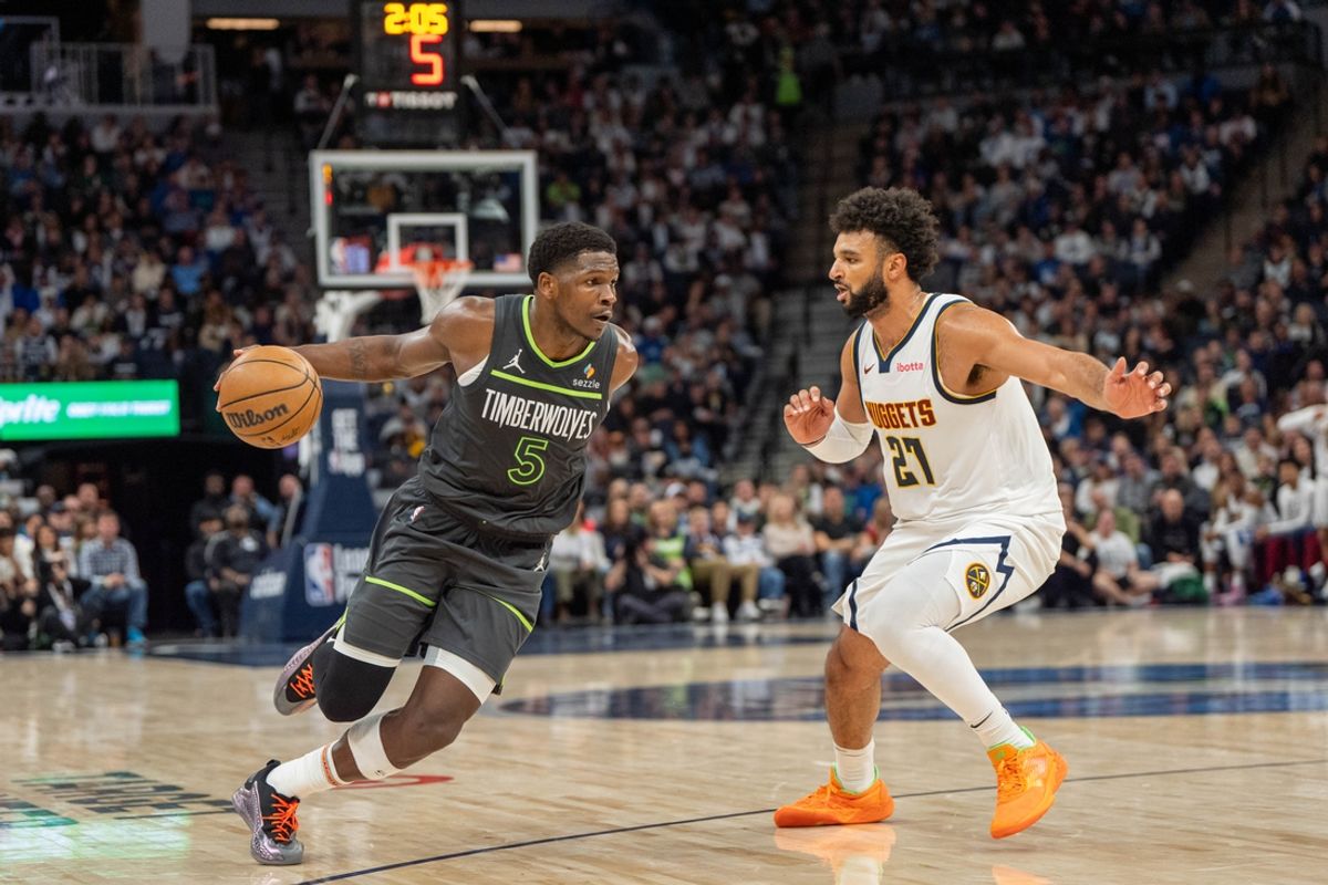 Nov 1, 2024; Minneapolis, Minnesota, USA; Minnesota Timberwolves guard Anthony Edwards (5) drives to the basket defended by Denver Nuggets guard Jamal Murray (27) in the second quarter at Target Center. Mandatory Credit: Matt Blewett-Imagn Images