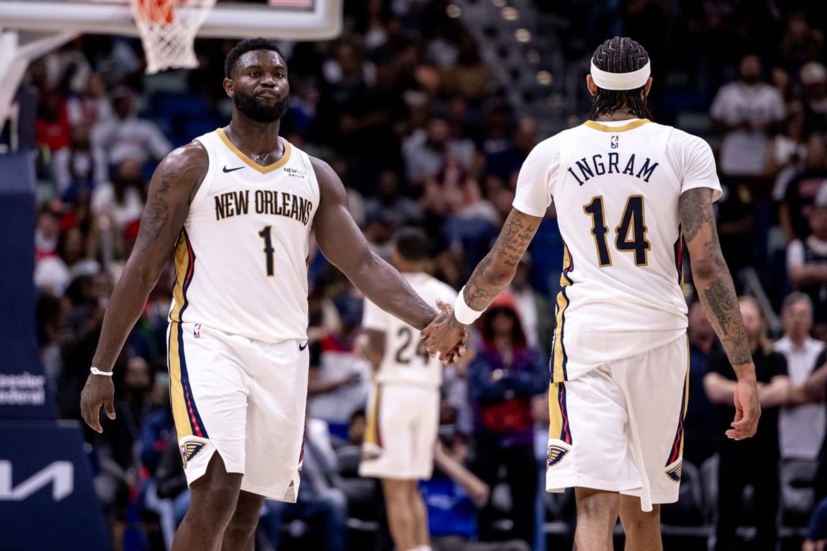 Nov 1, 2024; New Orleans, Louisiana, USA;  New Orleans Pelicans forward Brandon Ingram (14) slaps hands with forward Zion Williamson (1) after a play against the Indiana Pacers during the second half at Smoothie King Center. Mandatory Credit: Stephen Lew-Imagn Images