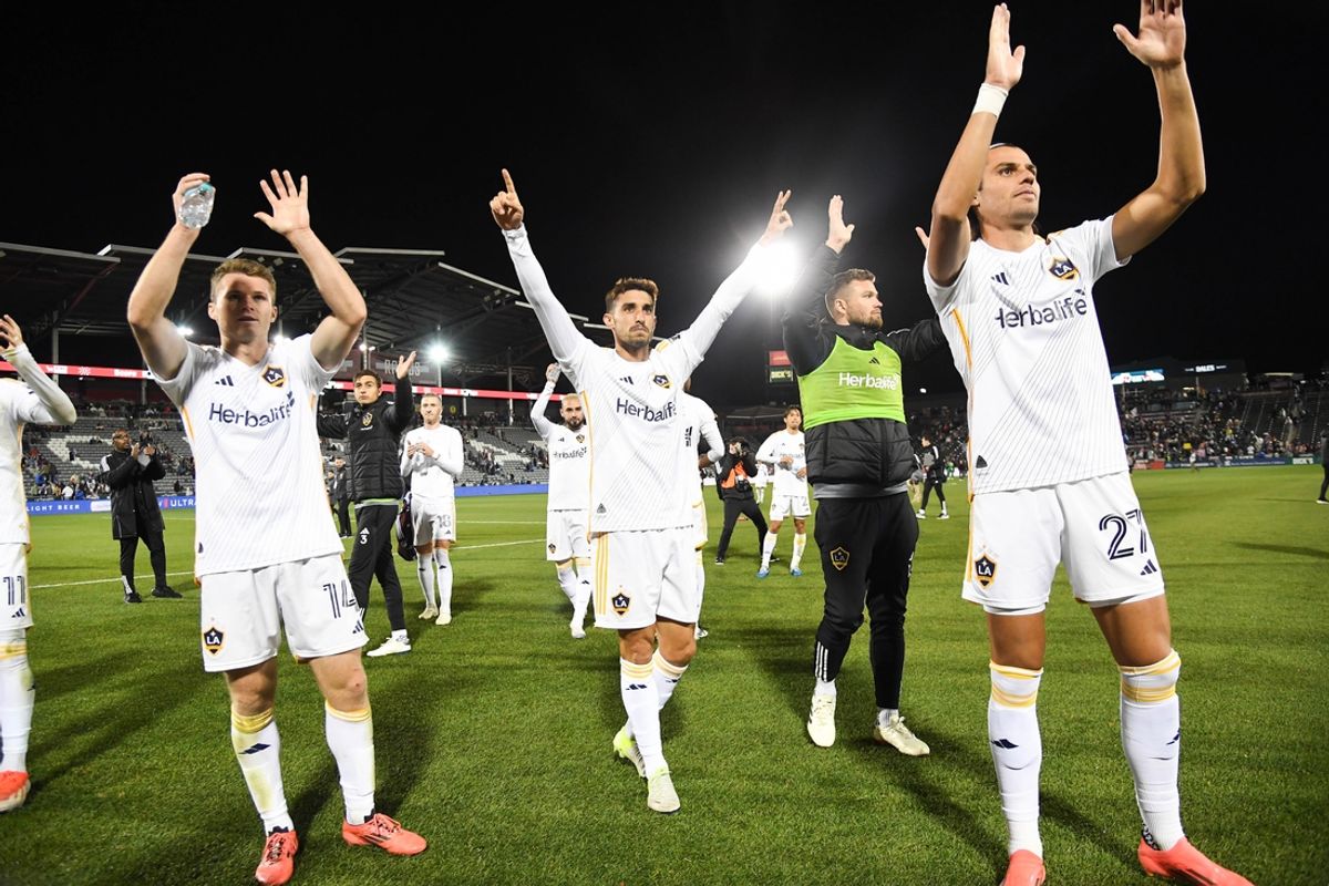 Nov 1, 2024; Commerce City, Colorado, USA; LA Galaxy defender John Nelson (14), LA Galaxy midfielder Gaston Brugman (5), and LA Galaxy forward Miguel Berry (27) wave to fans after defeating the Colorado Rapidsin a 2024 MLS Cup Playoffs Round One match at Dick's Sporting Goods Park. Mandatory Credit: Christopher Hanewinckel-Imagn Images