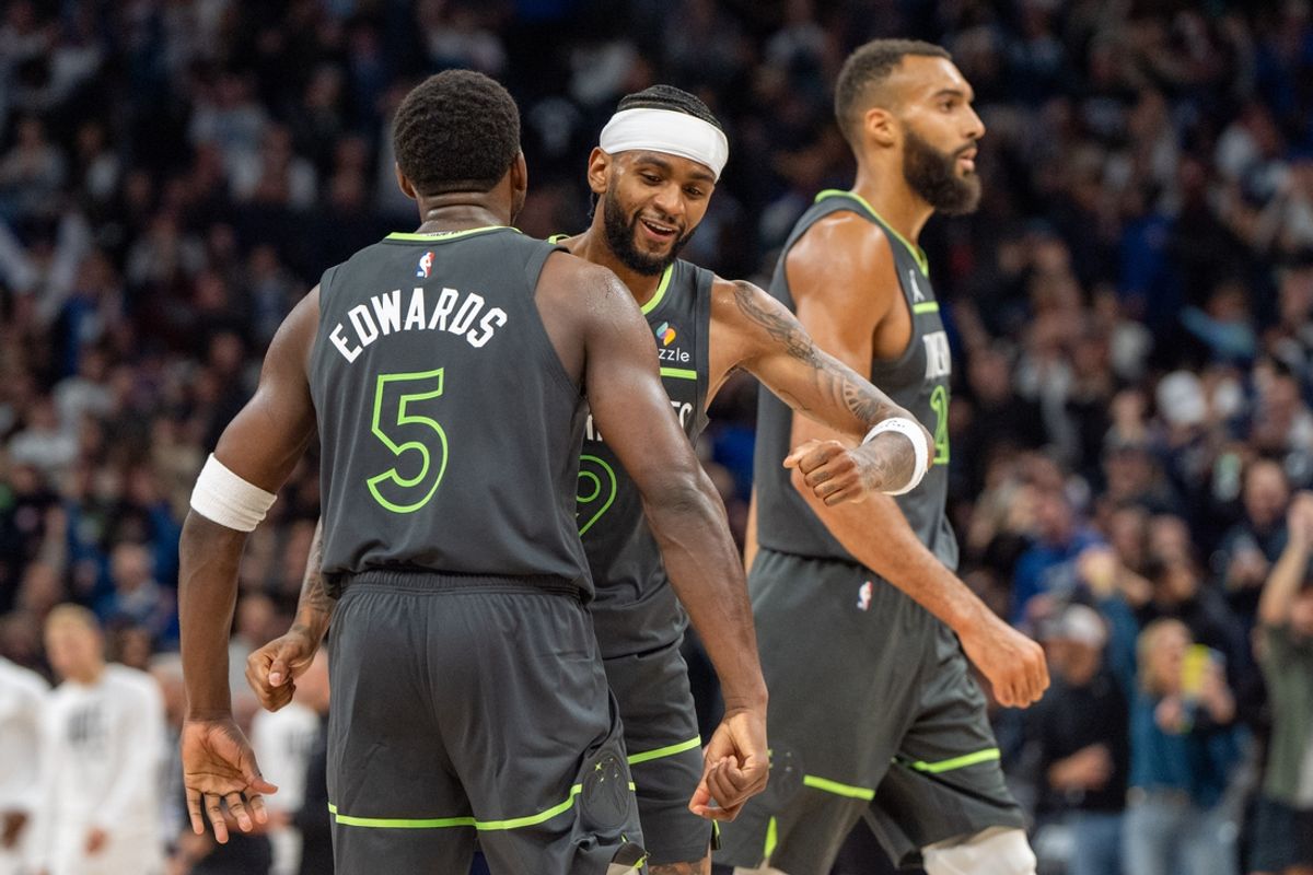 Nov 1, 2024; Minneapolis, Minnesota, USA; Minnesota Timberwolves guard Anthony Edwards (5) and Minnesota Timberwolves guard Nickeil Alexander-Walker (9) celebrate a win over the Denver Nuggets as the final buzzer sounds at Target Center. Mandatory Credit: Matt Blewett-Imagn Images