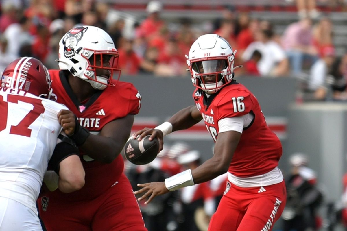 Nov 2, 2024; Raleigh, North Carolina, USA;  North Carolina State Wolfpack quarter back CJ Bailey (16) drops the ball back for a pass during the second quarter against Stanford Cardinals at Carter-Finley Stadium. Mandatory Credit: Zachary Taft-Imagn Images