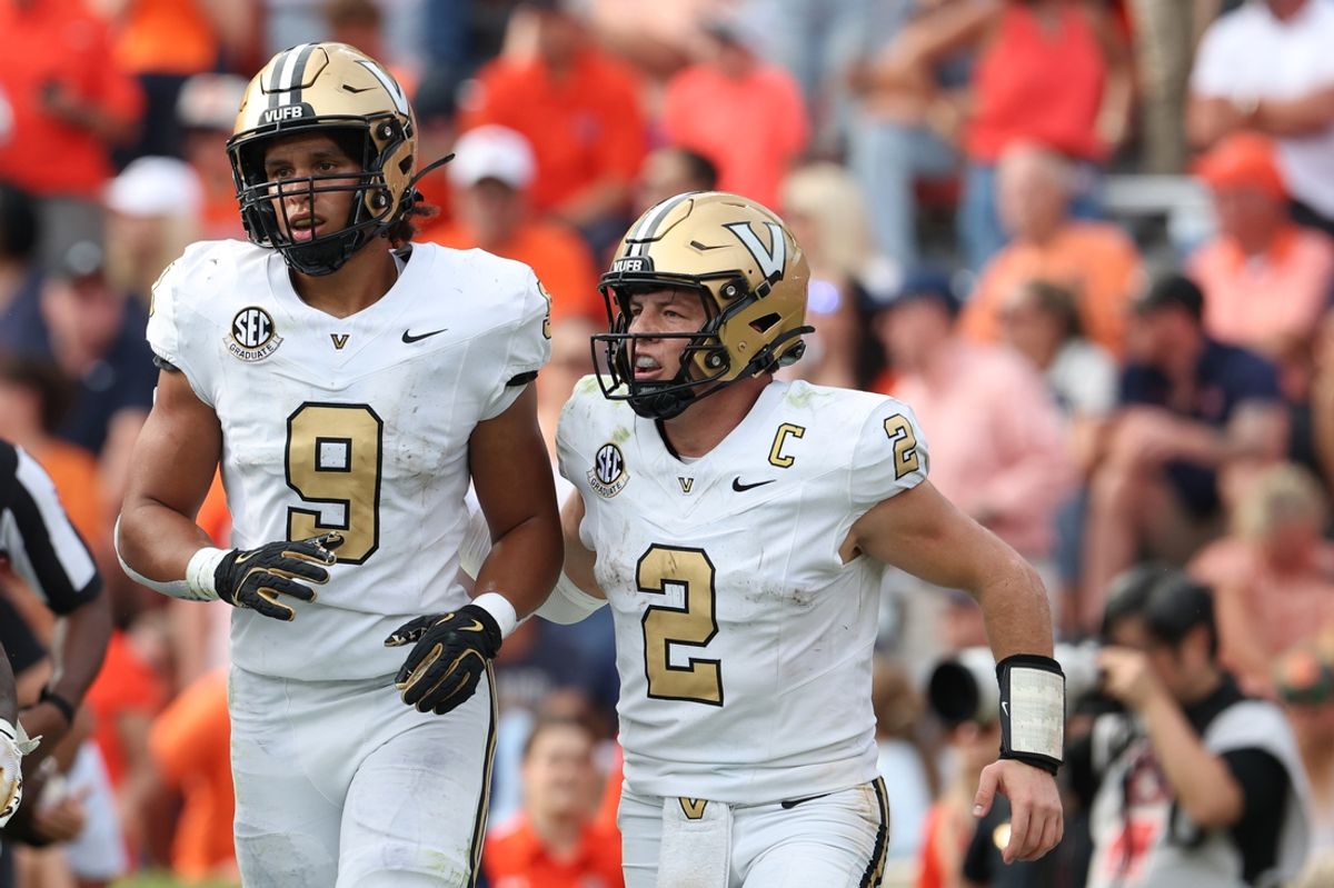 Nov 2, 2024; Auburn, Alabama, USA;  Vanderbilt Commodores quarterback Diego Pavia (2) celebrates with tight end Eli Stowers (9) after a touchdown during the fourth quarter against the Auburn Tigers at Jordan-Hare Stadium. Mandatory Credit: John Reed-Imagn Images