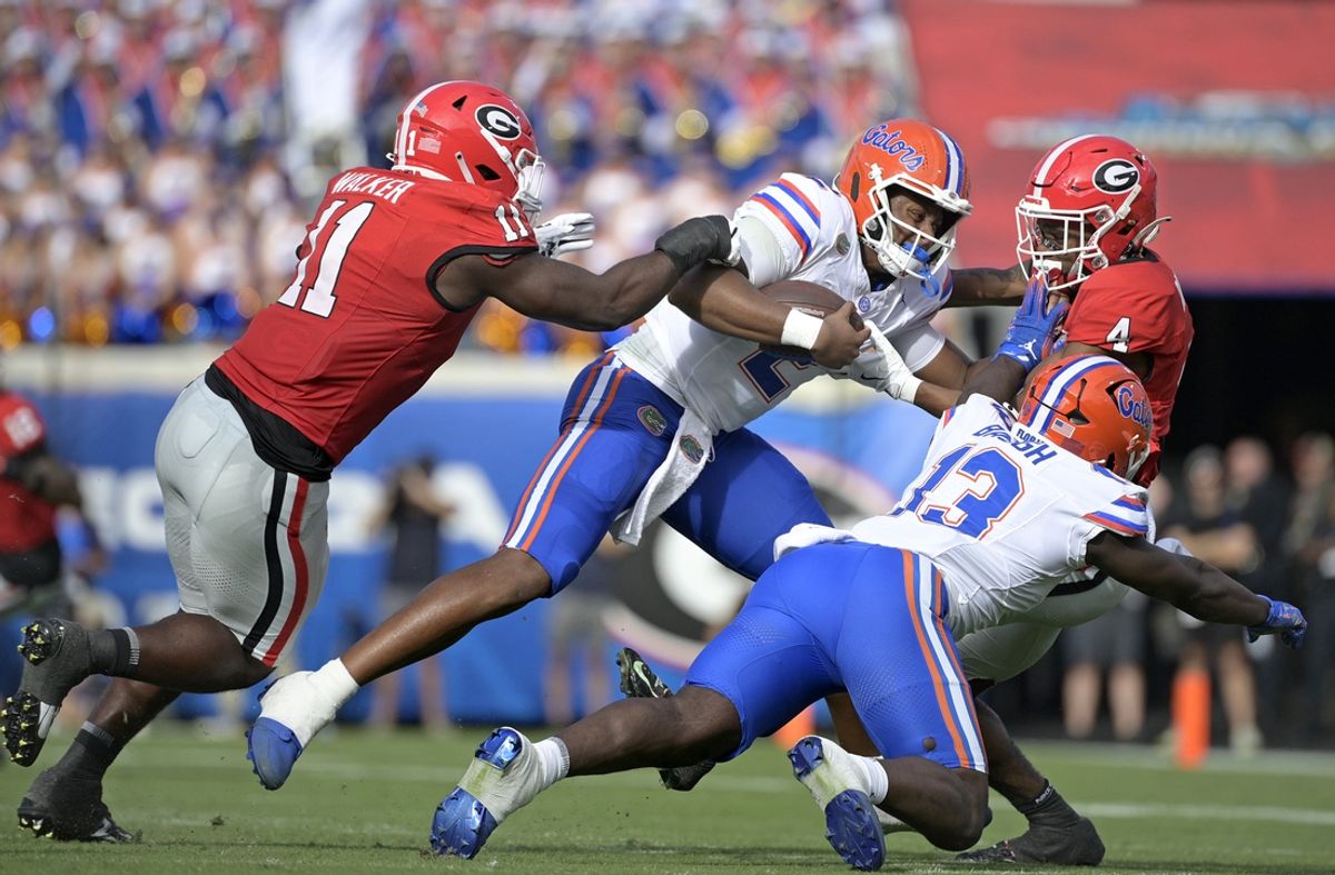 Nov 2, 2024; Jacksonville, Florida, USA; Florida Gators quarterback DJ Lagway (2) is tackled against the Georgia Bulldogs during the first half at EverBank Stadium. Mandatory Credit: Melina Myers-Imagn Images