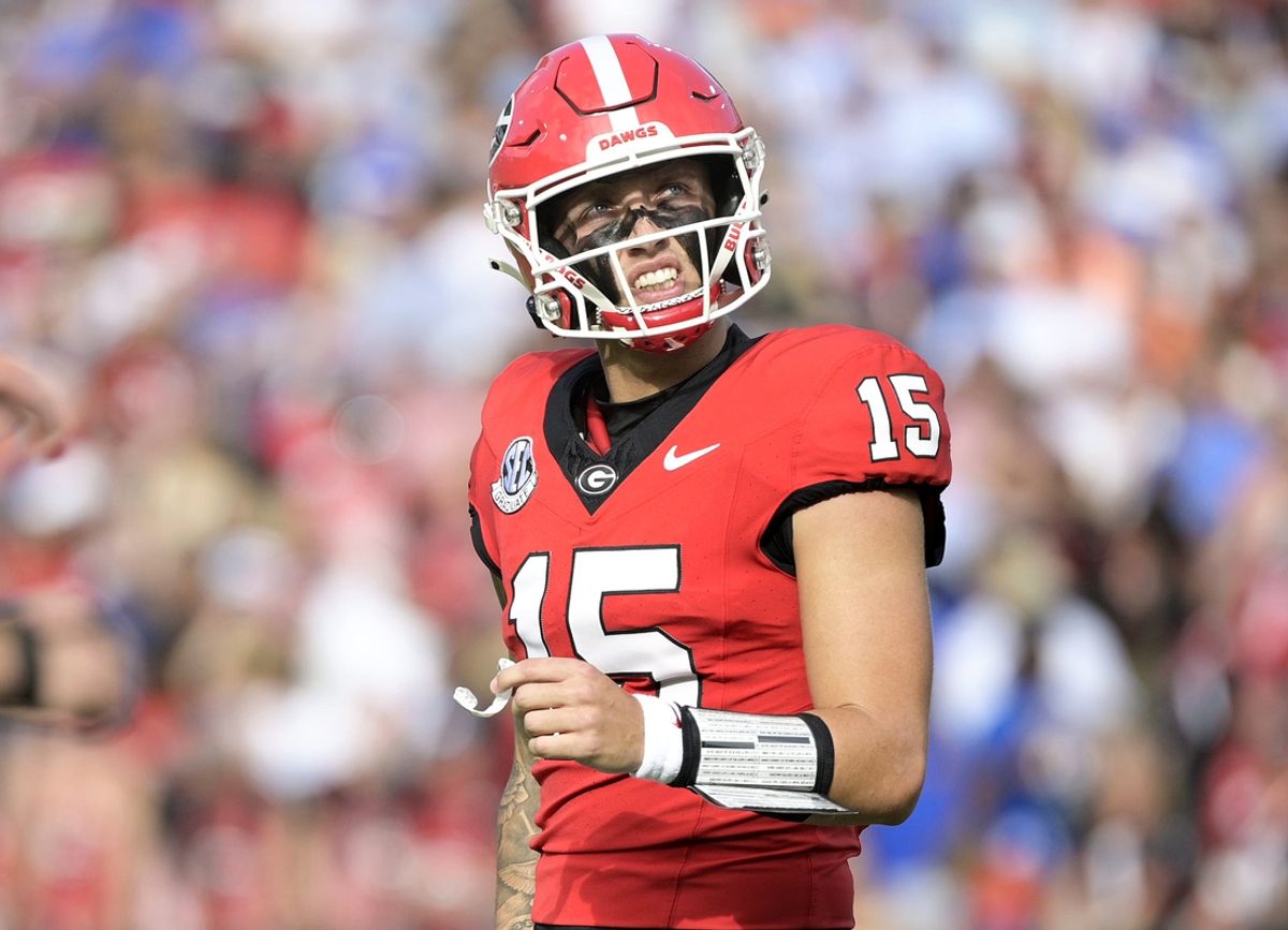 Nov 2, 2024; Jacksonville, Florida, USA; Georgia Bulldogs quarterback Carson Beck (15) reacts after throwing an interception against the Florida Gators during the first quarter at EverBank Stadium. Mandatory Credit: Melina Myers-Imagn Images