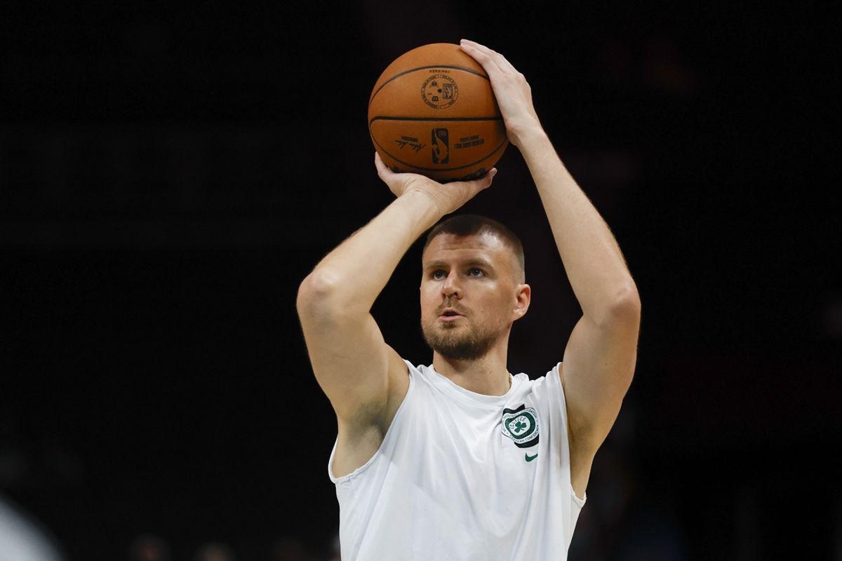 Nov 2, 2024; Charlotte, North Carolina, USA; Boston Celtics center Kristaps Porzingis shoots before a game against the Charlotte Hornets at Spectrum Center. Porzingis is on injured reserve. Mandatory Credit: Nell Redmond-Imagn Images