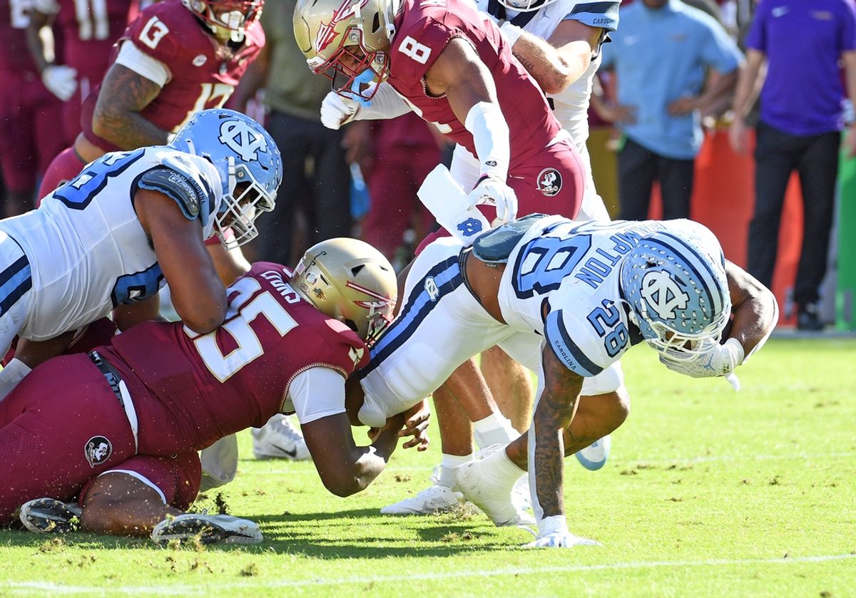 Nov 2, 2024; Tallahassee, Florida, USA;  North Carolina Tarheels running back Omarian Hampton (28) runs the ball against the Florida State Seminoles during the first quarter at Doak S. Campbell Stadium. Mandatory Credit: Robert Myers-Imagn Images