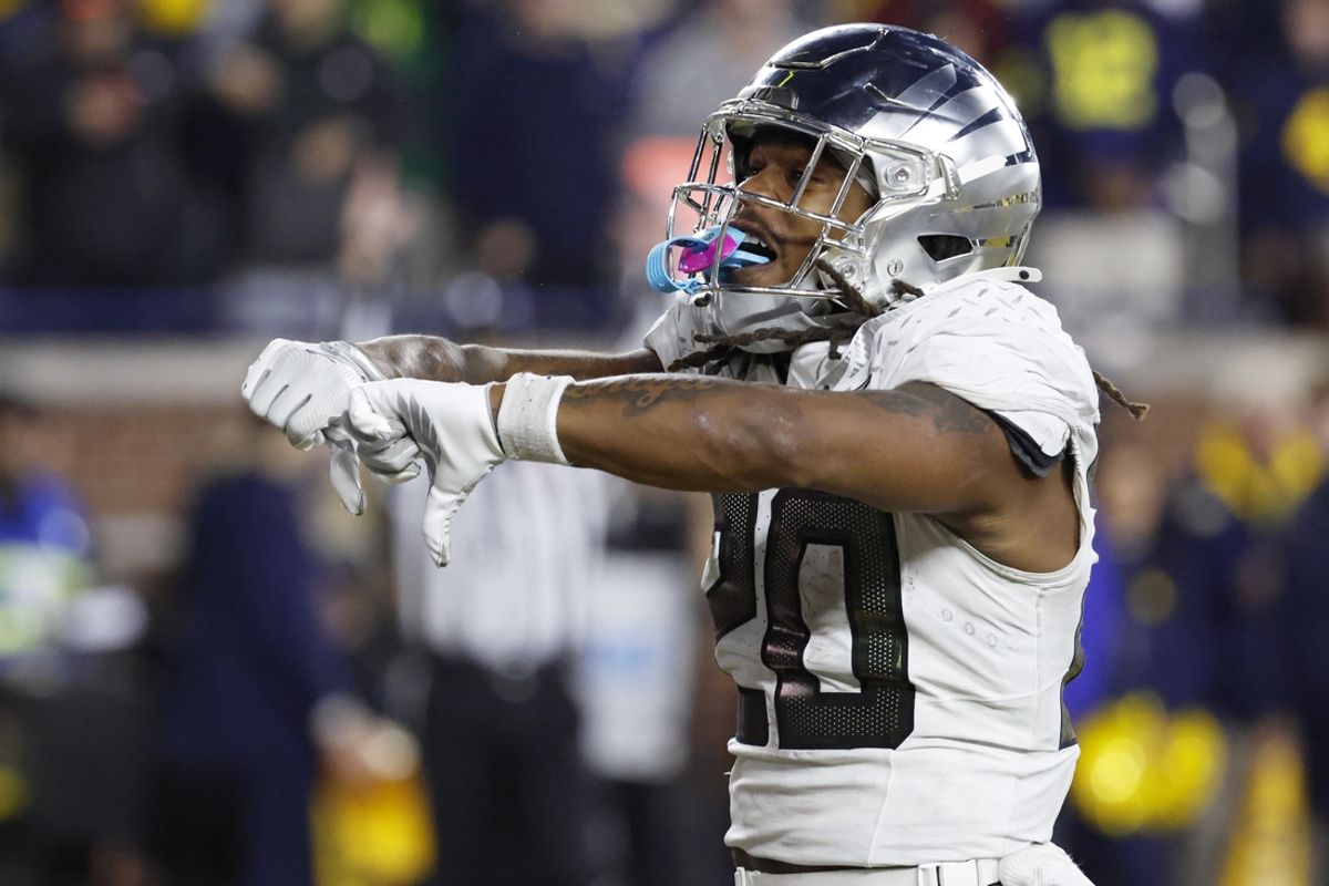 Nov 2, 2024; Ann Arbor, Michigan, USA;  Oregon Ducks running back Jordan James (20) celebrates after scoring a touchdown in the second half against the Michigan Wolverines at Michigan Stadium. Mandatory Credit: Rick Osentoski-Imagn Images