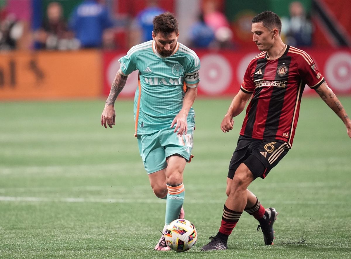 Nov 2, 2024; Atlanta, Georgia, USA; Inter Miami CF forward Lionel Messi (10) and Atlanta United midfielder Bartosz Slisz (6) battle for control of the ball during the second half in a 2024 MLS Cup Playoffs Round One match at Mercedes-Benz Stadium. Mandatory Credit: Dale Zanine-Imagn Images