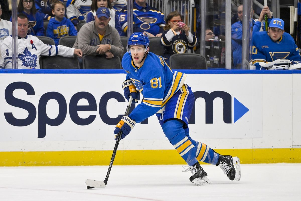 Nov 2, 2024; St. Louis, Missouri, USA;  St. Louis Blues center Dylan Holloway (81) controls the puck against the Toronto Maple Leafs during the second period at Enterprise Center. Mandatory Credit: Jeff Curry-Imagn Images
