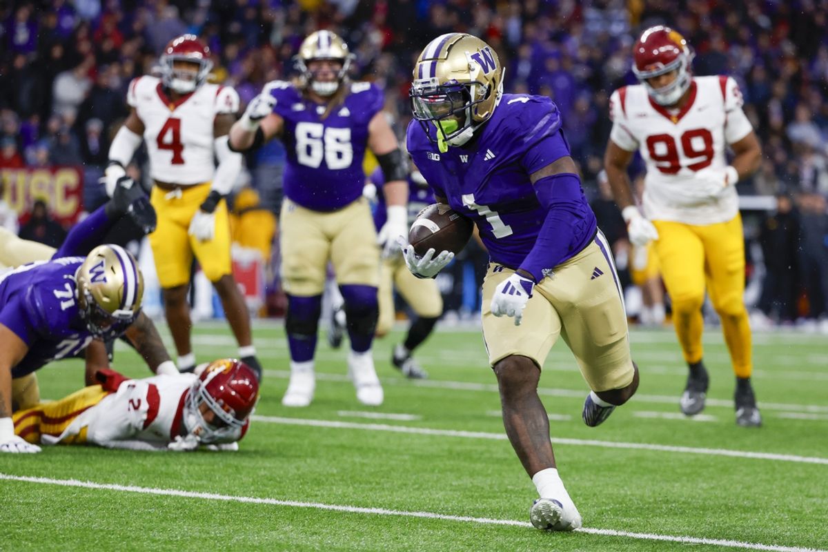 Nov 2, 2024; Seattle, Washington, USA; Washington Huskies running back Jonah Coleman (1) rushes for a touchdown against the USC Trojans during the second quarter at Alaska Airlines Field at Husky Stadium. Mandatory Credit: Joe Nicholson-Imagn Images
