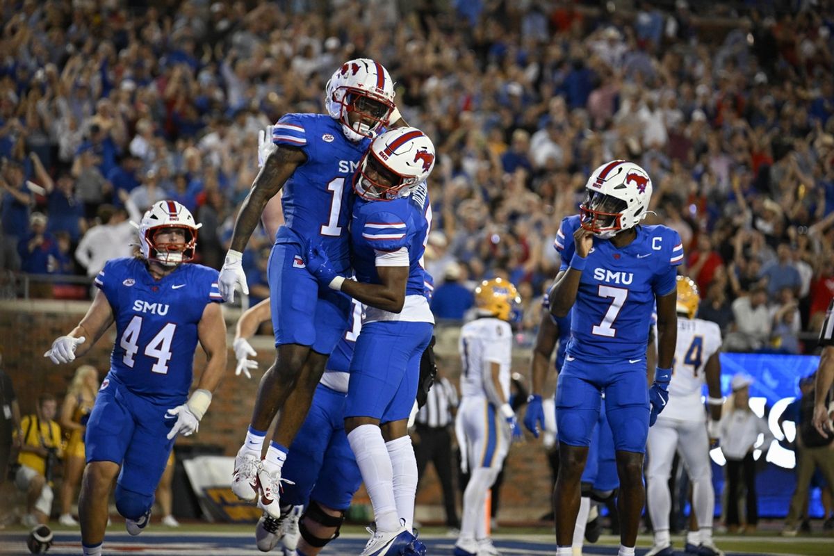 Nov 2, 2024; Dallas, Texas, USA; Southern Methodist Mustangs tight end Stone Eby (44) and wide receiver Roderick Daniels Jr. (13) and wide receiver Moochie Dixon (5) and quarterback Kevin Jennings (7) celebrate a touchdown against the Pittsburgh Panthers during the first half at Gerald J. Ford Stadium. Mandatory Credit: Jerome Miron-Imagn Images