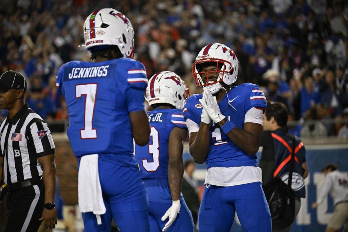 Nov 2, 2024; Dallas, Texas, USA; Southern Methodist Mustangs quarterback Kevin Jennings (7) and running back Brashard Smith (1) celebrate a touchdown against the Pittsburgh Panthers during the first half at Gerald J. Ford Stadium. Mandatory Credit: Jerome Miron-Imagn Images