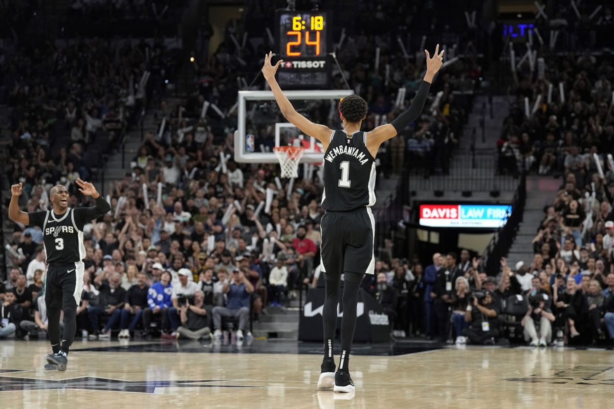Nov 2, 2024; San Antonio, Texas, USA; San Antonio Spurs center Victor Wembanyama (1) and guard Chris Paul (3) react during the second half against the Minnesota Timberwolves at Frost Bank Center. Mandatory Credit: Scott Wachter-Imagn Images