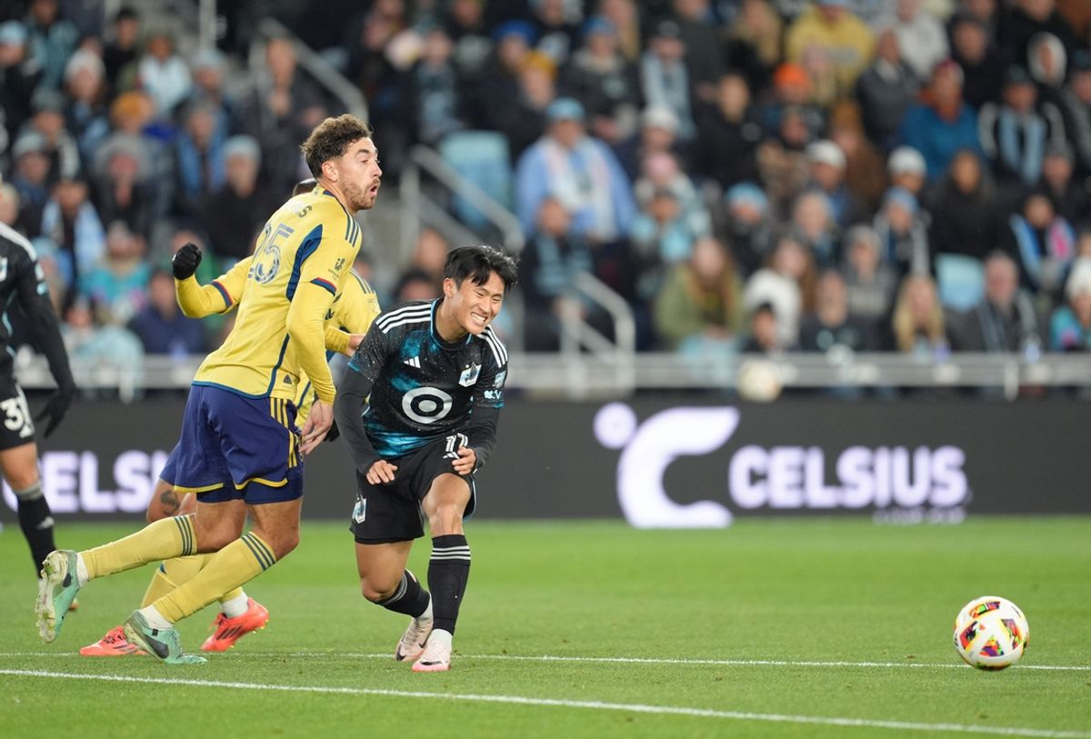 Nov 2, 2024; Saint Paul, Minnesota, USA; Minnesota United forward Sang Bin Jeong (11) and Real Salt Lake midfielder Matt Crooks (25) battle for control of the ball during the second half in a 2024 MLS Cup Playoffs Round One match at Allianz Field. Mandatory Credit: Matt Blewett-Imagn Images