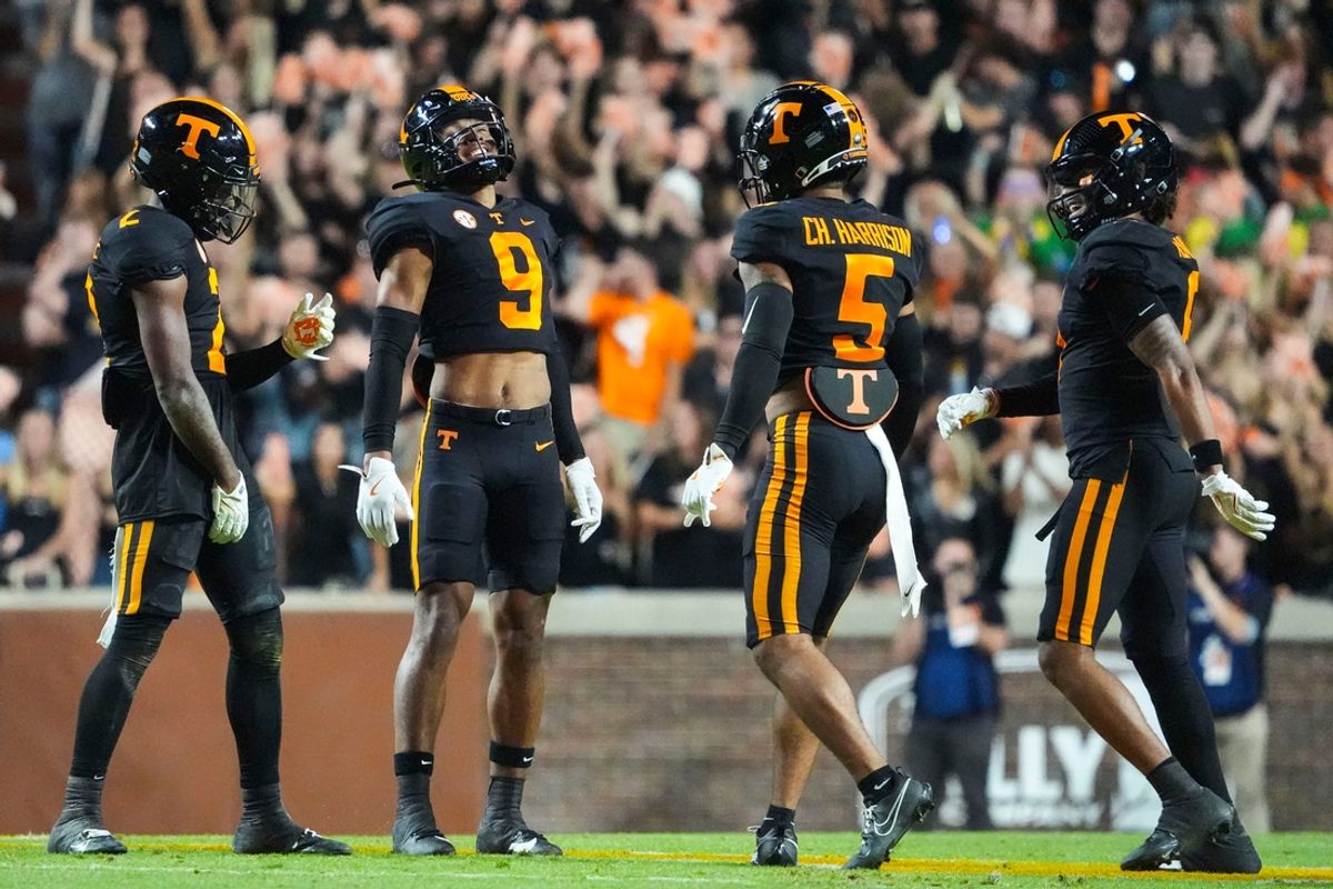Nov 2, 2024; Knoxville, Tennessee, USA; Tennessee Volunteers defensive back Andre Turrentine (2) celebrates with defensive back Jakobe Thomas (9), defensive back Christian Harrison (5), and defensive back Jalen McMurray (6) after making an interception against the Kentucky Wildcats) during the first half at Neyland Stadium.. Mandatory Credit: Caitie McMekin/USA TODAY Network via Imagn Images